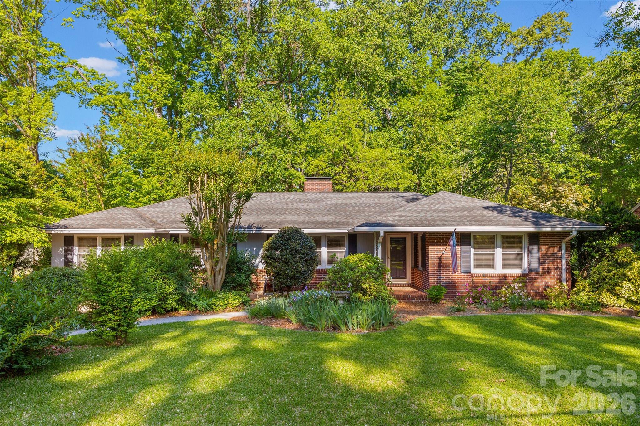 Walk the coveted neighborhood of Whiteville Park with its tree-lined streets and friendly faces and you will see why folks are anxious to call it home! This 1950's brick ranch is loaded with character and situated on a very rare one acre lot! You will love the warm hardwood floors, formal spaces, masonry fireplaces and wonderful porch on the back. The bedrooms are spacious and bathrooms have charming tile. The garage conversion is now a large bedroom and oversized laundry room. This home has been well loved and has so much potential for the new owners to make it theirs. The beautifully landscaped yard is full of flowers and mature trees. The back yard is private with a great shed with work space and offers so much room for expansion or other outbuildings. Homes in this neighborhood rarely come available so do not delay!