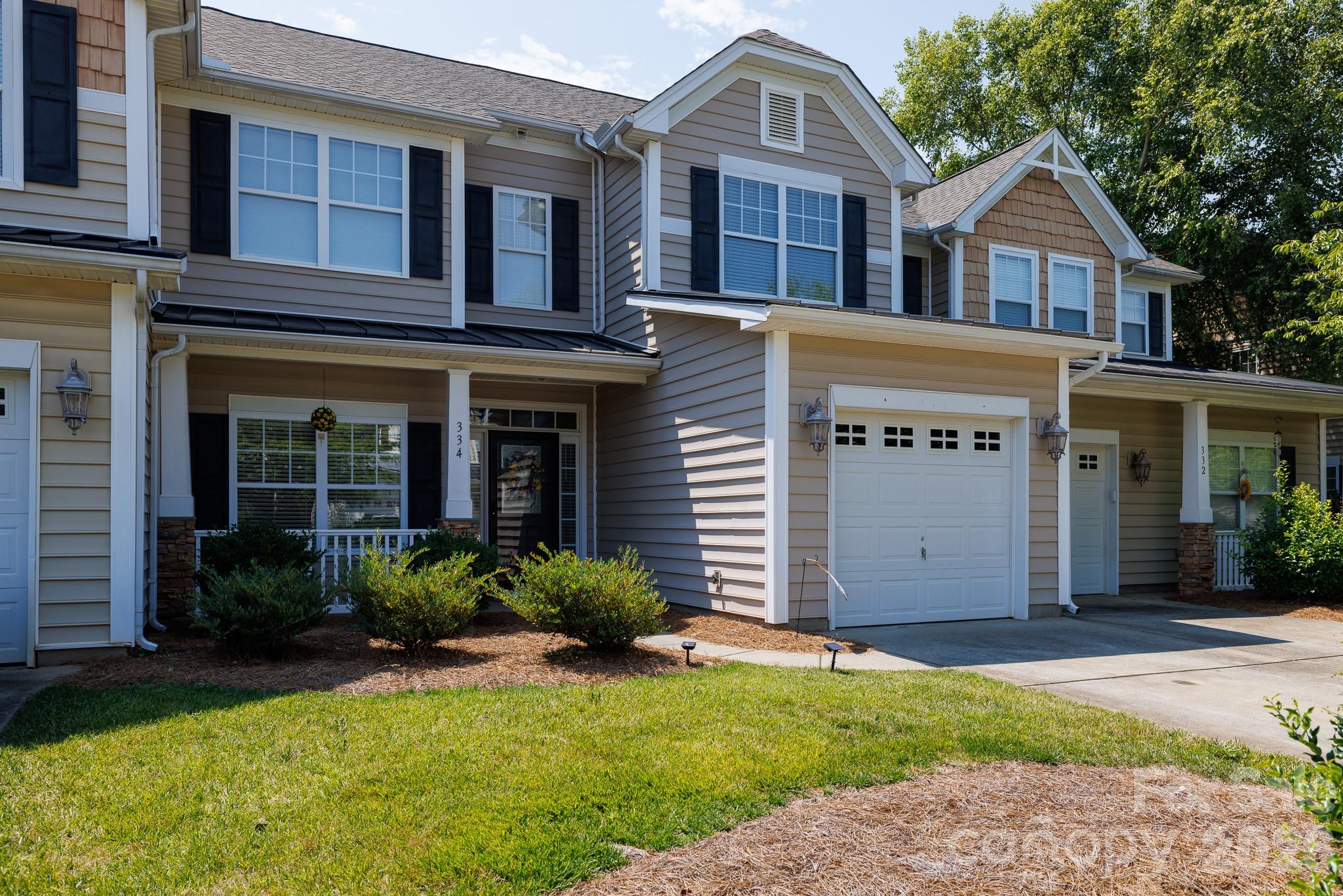 Welcome to 334 Rose Garden Court, where thoughtful design and low-maintenance living come together in one of Rock Hill's most desirable townhouse communities. From the moment you step inside, you'll appreciate the bright, open-air floor plan and soaring two-story living room that creates an inviting space for both everyday living and entertaining.

The well-appointed kitchen overlooks the living area and features granite countertops, stainless steel appliances, and generous prep space, making it the true heart of the home. The main-level primary suite offers comfort and convenience with an en-suite bath showcasing a double-sink vanity, garden tub, and separate shower. Also on the main level are a formal dining room, laundry room, and a convenient half bath.
Upstairs, a versatile loft provides the perfect space for a home office, media room, or play area, along with two additional bedrooms and a full bath. The flexible floor plan offers plenty of room to fit your lifestyle.
Step outside to your private rear patio, ideal for enjoying morning coffee, grilling with friends, or relaxing after a long day. A one-car garage provides additional storage and everyday convenience.

Residents enjoy a welcoming community with sidewalk-lined streets, and recreation areas. Located just minutes from historic downtown Rock Hill, you'll have easy access to local restaurants, shopping, parks, and year-round community events. 

Offering an exceptional floor plan, outstanding amenities, and an unbeatable location, this move-in-ready townhome is one you won't want to miss.