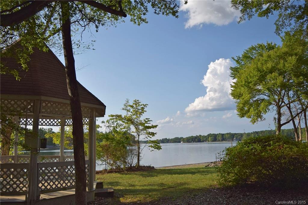 Wonderful view, wonderful value! Waterfront home on the Allison Creek peninsula of Lake Wylie. Four bedrooms and big level lot with new boat dock. Relax in the lakeside gazebo and enjoy the beauty of the lake. Hardwood floors throughout the home.  Vintage pine cabinets in the kitchen, tile in baths. Master plus 2nd bedroom on main level, plus 2 bedrooms upstairs. Home is ready for you to update and fix up a bit to make it your own! Excellent Clover schools. low cost of living with SC taxes.