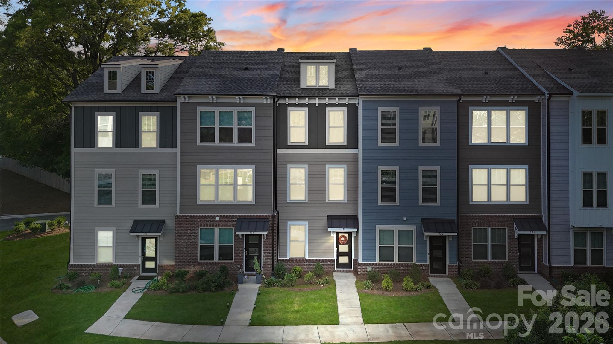 Stunning & Impeccably maintained three-level townhouse offering 2 bedrooms and 2.5 bathrooms. The open-concept main level features stylish vinyl plank flooring and numerous upgrades with custom designer touches throughout. The bright, airy living space flows seamlessly into the modern kitchen, complete with abundant cabinetry, custom tile backsplash, generous counter space, a center island with breakfast bar, and a dedicated pantry. The dramatic dining area showcases board-and-batten detailing, custom paint, and direct access to the balcony—perfect for entertaining. Upstairs, a split-bedroom layout provides dual primary suites, each with private ensuite baths for ultimate comfort and privacy. An attached garage adds convenience, while city views offer a touch of urban charm. This home beautifully blends comfort, style, and location—an exceptional place to call home.