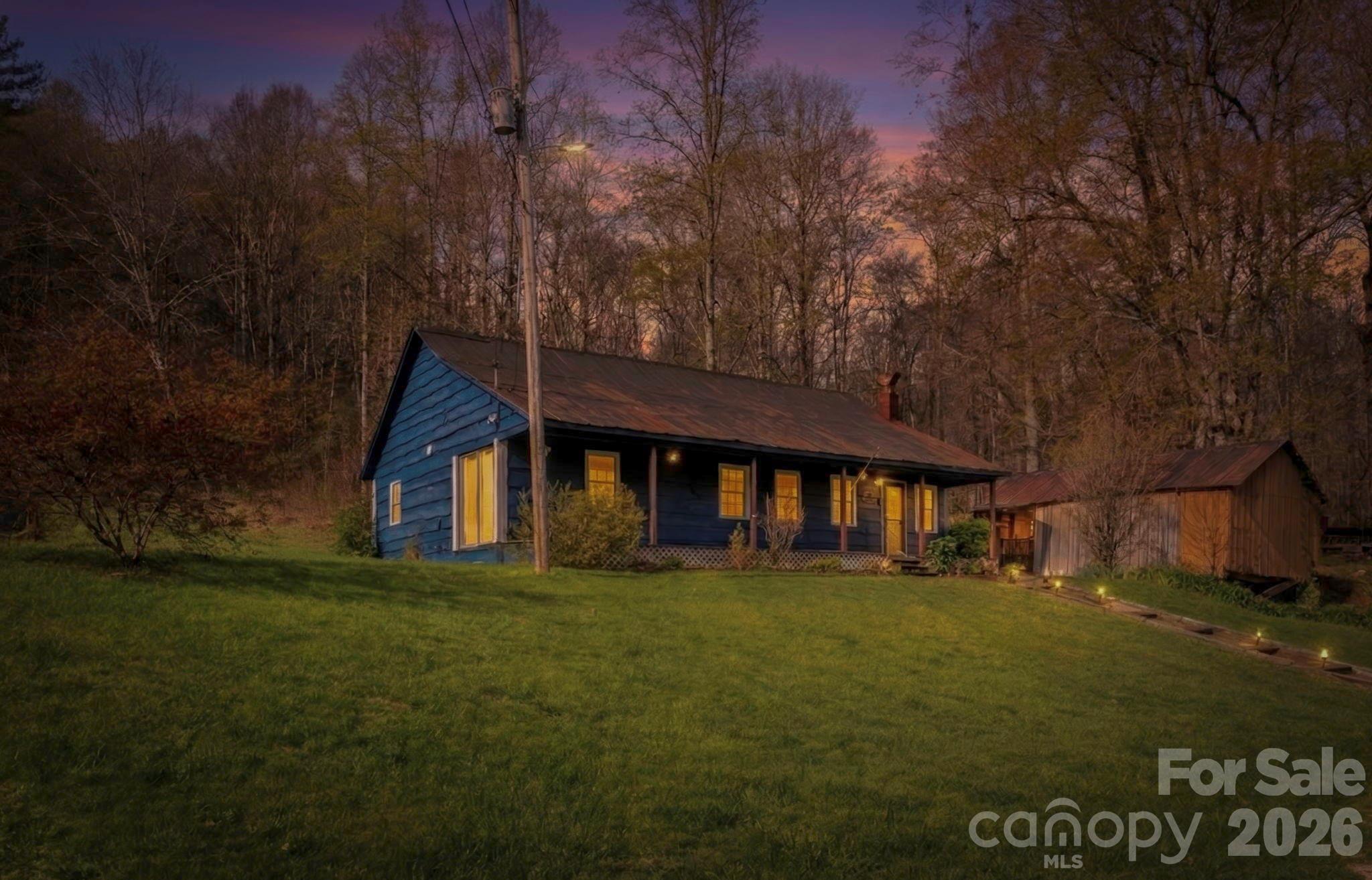 Welcome to 3041 Bald Mountain Rd — a charming classic farmhouse nestled on 10 beautiful acres in the peaceful Bald Mountain area. Featuring 2 bedrooms and 1 bathroom, this home offers cozy living with a recently updated kitchen that blends modern touches with timeless farmhouse charm.

Step outside to a large, inviting front yard and unwind on the covered front porch, complete with a porch swing — the perfect spot to enjoy your morning coffee or relax in the evenings while listening to the soothing sounds of the nearby babbling creek.

This property provides the ideal setting for homesteading, gardening, or simply escaping the hustle and bustle of a fast-paced lifestyle. The land offers ample space for livestock, crops, or creating your dream outdoor oasis.

An additional septic system is already in place on the property, offering excellent potential for future investment, expansion, or a second home.

Whether you’re searching for a private getaway, a working homestead, or a place to expand, this unique property offers endless possibilities in a beautiful Western North Carolina setting.