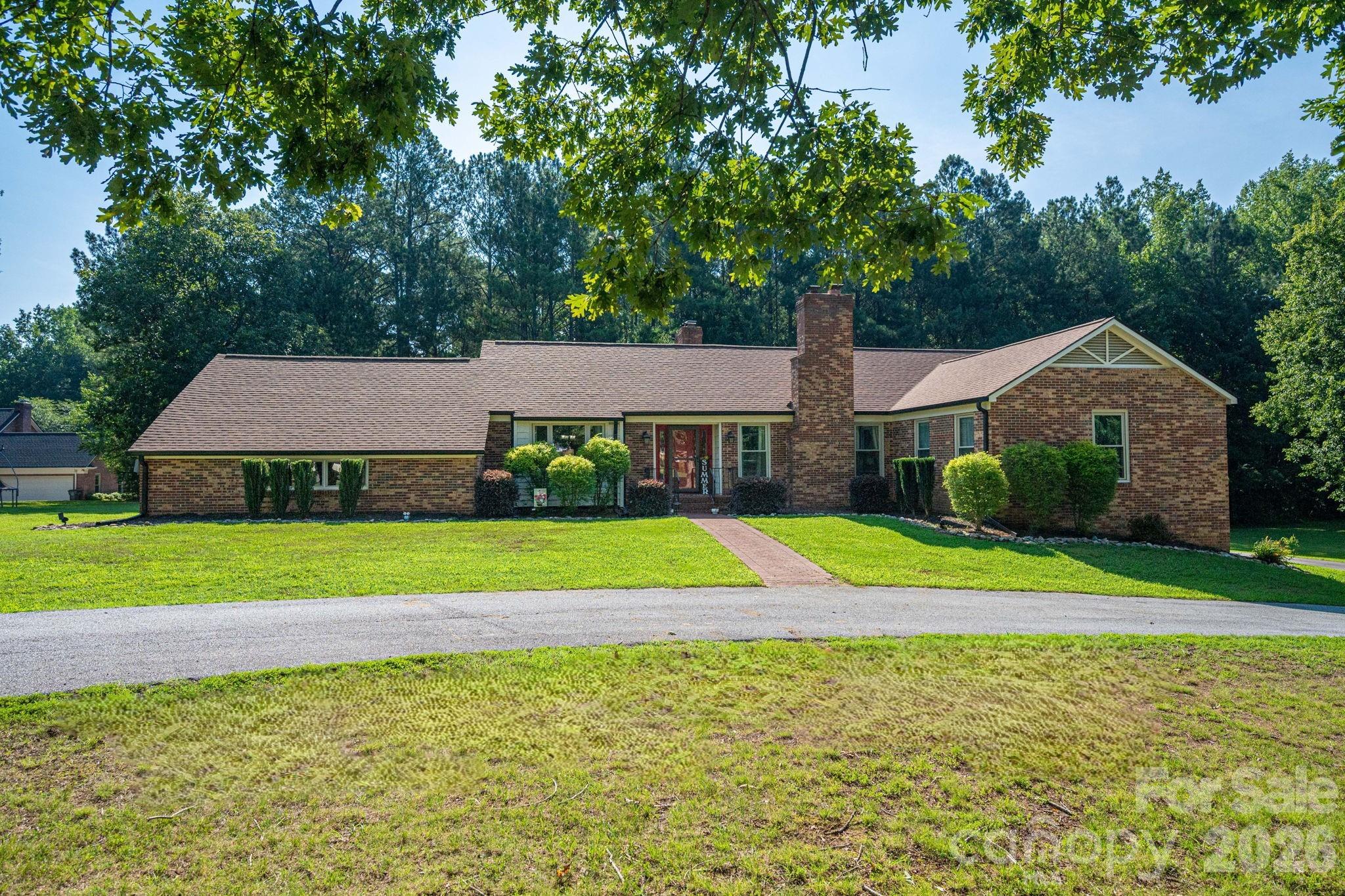 Beautifully Renovated Brick Home on over an acre with Exceptional Space & Multi-Generational Living Potential!
Welcome to this beautifully updated brick home where timeless character meets modern convenience. Situated on two parcels totaling approximately 1.27 acres, this property offers an abundance of indoor and outdoor living space with thoughtful upgrades throughout.
The spacious main level is designed for both everyday living and entertaining, featuring generously sized living, dining, kitchen, family room, and laundry areas. One of the home’s standout features is the see-through fireplace that creates a warm, inviting connection between the kitchen and family room. The stunning eat-in kitchen boasts custom cabinetry, quartz countertops, stainless steel appliances, a pot filler, and a large center island with a laminated butcher block countertop, making it the perfect gathering place for family and friends.
Another exceptional feature is the two main-level ensuite bedrooms, each offering its own private bathroom. The spacious primary suite showcases stylish sliding barn doors, large walk-in closet and updated bathroom while other abundant closet space throughout the home provides excellent storage.
Recent updates include premium luxury laminate flooring throughout the main living areas and in the basement, new lighting, fresh interior paint, updated garage doors, attractive shiplap accents in the laundry room, new gas logs, new roof, new HVAC unit and new windows. Updated black metal railings were added to the stairway too.  
The lower-level basement is a plus offering outstanding multi-generational living potential with both interior access and a separate exterior entrance. This versatile space includes a second full kitchen with refrigerator, electric range, and microwave, dining area, a spacious living area, two bedrooms sharing a full bath, a secondary laundry area, and a workshop, making it ideal for extended family, guests, or flexible living arrangements.
Step outside to enjoy your own backyard retreat featuring a large fenced patio area, newly added covered hot tub space that conveys, mature landscaping, and a circular driveway—perfect for relaxing or entertaining year-round.
The parcel containing the home is not located in a FEMA floodplain. The additional parcel extends to the creek and includes a floodplain area, providing added privacy and a natural setting.
Offering incredible flexibility, generous living spaces, extensive updates, and outstanding indoor and outdoor amenities, this move-in-ready home is truly one of Cherryville’s unique opportunities.