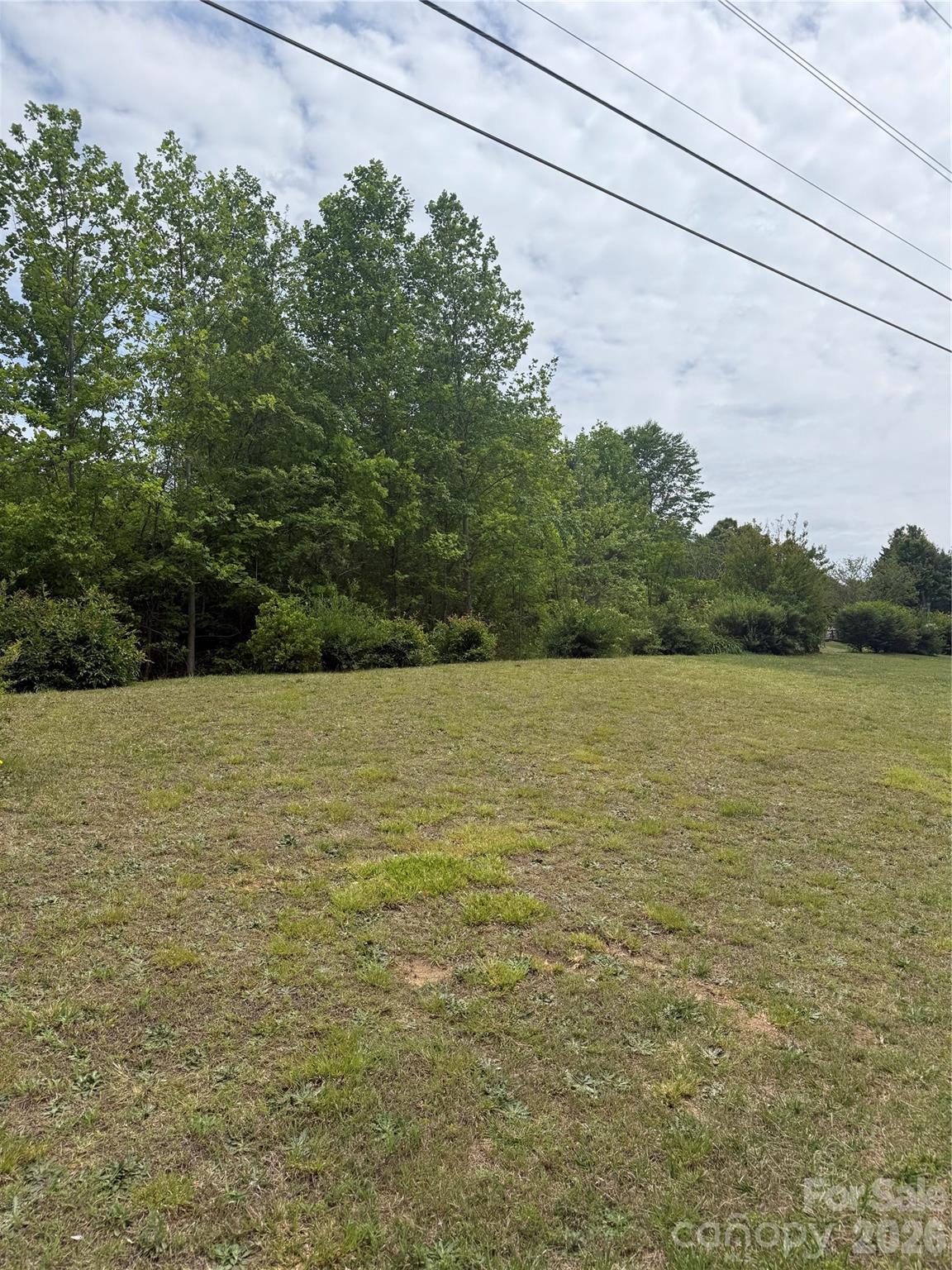 Build your mountain getaway, investment property, or private retreat on this unrestricted 1-acre lot in beautiful Polk County, NC! Priced at just $34,000, this property offers over 100 feet of road frontage and plenty of potential for the right buyer. The lot features a steep, wooded landscape with a partially level area that could make a great homesite, camper spot, or weekend escape. With no known restrictions, you’ll have the flexibility to explore a variety of uses. A deeded easement for a neighboring driveway runs through the property. Conveniently located just minutes from the Tryon International Equestrian Center and a short drive to Lake Lure and Chimney Rock State Park, this property offers the perfect mix of privacy and accessibility. Affordable land opportunities like this are hard to find!
No sign at the property. Call listing agent for directions.
