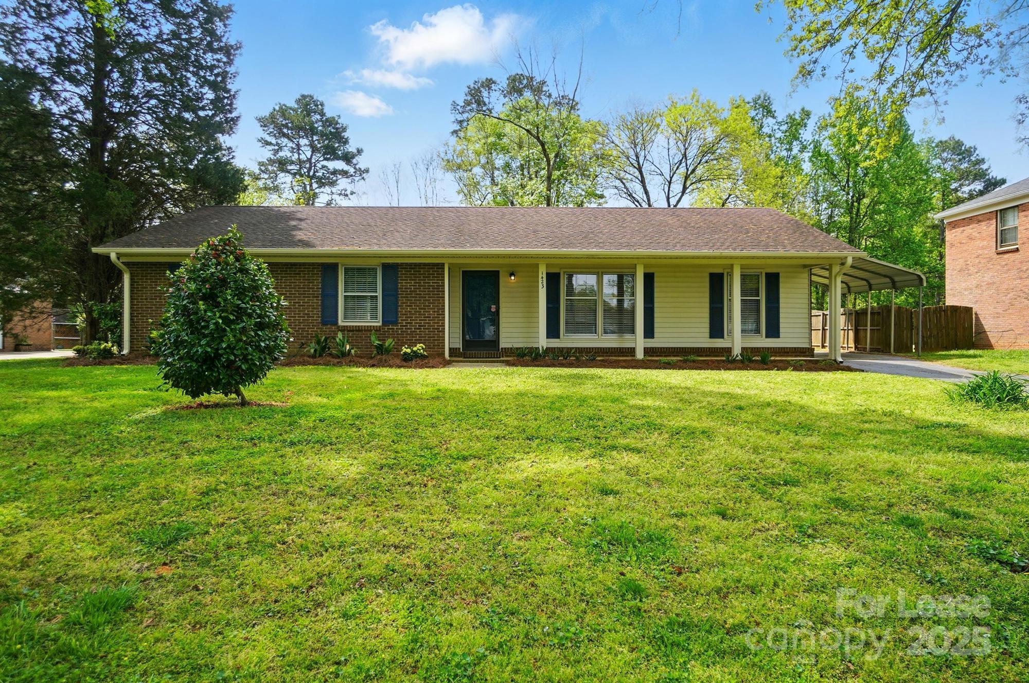 Welcome to this charming 3-bedroom, 2-bathroom brick ranch home, situated on a quiet, tree-lined street in the desirable McClintick Woods neighborhood. This move-in ready home offers easy, one-level living with plenty of updates. Gleaming parquet hardwood floors greet you in the formal living room and dining room, both filled with natural light that creates a bright, welcoming ambiance. The spacious den features vaulted ceilings and a cozy wood-burning fireplace, perfect for relaxation. The eat-in kitchen is generously size. Large mudroom with convenient storage and washer/dryer hookups, leading to the covered carport. Spacious bedrooms with ample closet space. The Primary bedroom has ensuite owner's bath includes a tub/shower combo, while the hall bath also features a tub/shower combo with updated tile. Outside, the expansive, private backyard is perfect for outdoor activities and includes a private deck, a storage shed. Call us to schedule a Tour!