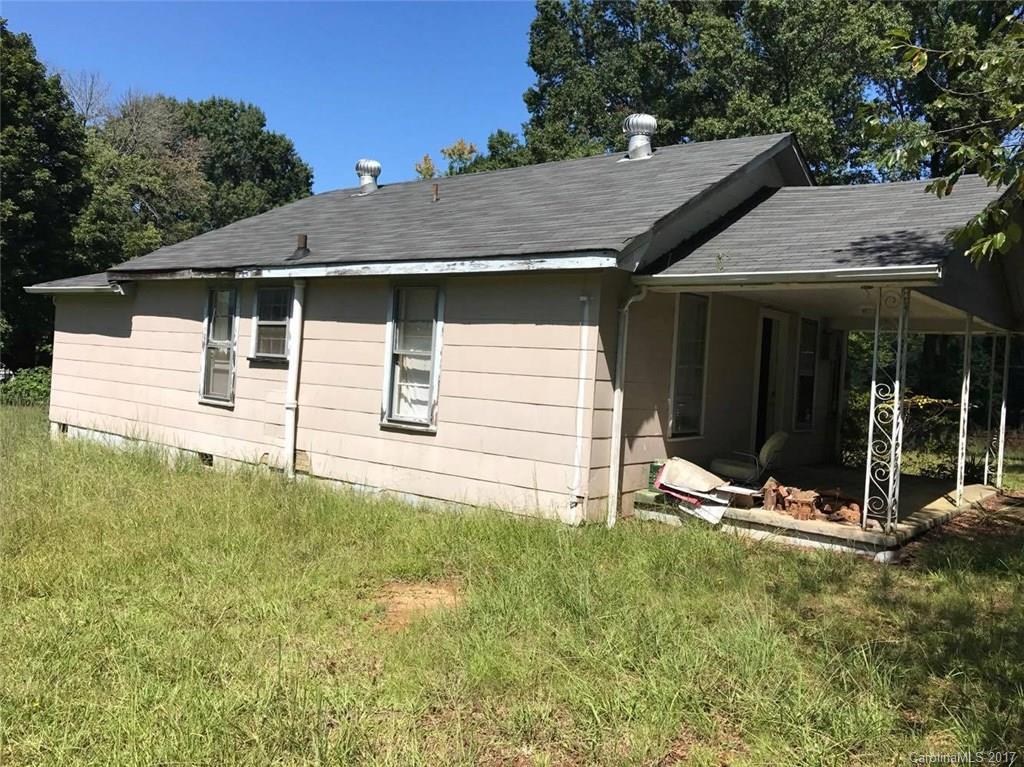 Sold "As Is". No HVAC. On SIZABLE lot. Great investment opportunity!! Needs work and TLC fixer-upper with great potential! Close to shopping and restaurants.