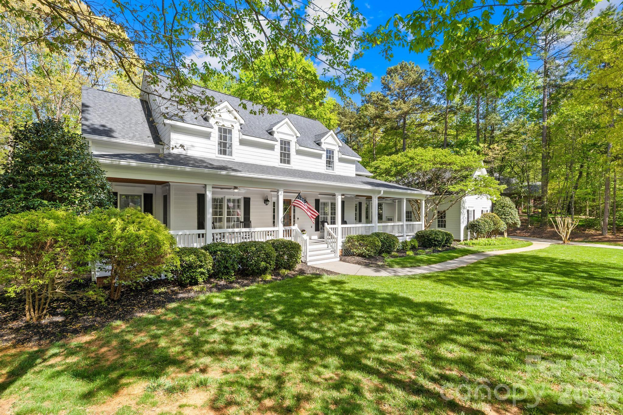 DEEDED BOAT SLIP & 1.57-ACRE FARMHOUSE RETREAT with Primary bedroom on the main! Start living the Lake Norman lifestyle in this well-maintained farmhouse, perfectly situated on a private, wooded lot in the sought-after Northview Harbor community. A picturesque, tree-lined street leads you to this classic home in the cul-de-sac, featuring an expansive wraparound porch—the ultimate spot for morning coffee or sunset views. Designed for modern living, this home offers abundant space for family, guests, and effortless entertaining inside and out.


*The Main & Upper Levels:*
The interior is light, airy, and move-in ready with fresh paint (2026), classic plantation shutters, and durable hardwoods throughout the main level. Relax in the living room by the fireplace, which frames serene views of the lush, wooded backdrop. The layout is designed for easy entertaining, featuring both a spacious kitchen dining area and an elegant formal dining room. The primary suite serves as a quiet main-floor retreat, while the upper level offers three comfortable bedrooms and a large bonus room—perfect for a playroom, media center, or hosting extra guests.


*The Standout Basement:*
The fully finished walk-out basement is a true highlight. This expansive level features a second living room, a private home office, and a dedicated gym. It also includes a comfortable guest suite with a private full bath and an adjoining flex room—offering the perfect setup for multi-generational living, a long-term guest wing, or a premium work-from-home environment. You'll also find plenty of extra storage throughout.


*Outdoor Oasis:*
Step outside to your private, fenced backyard sanctuary. The expansive lawn offers areas ideal for recreation, from cornhole to ball games, all set against a wooded backdrop. Enjoy updated hardscaping and a firepit area, while the irrigation system keeps the lawn pristine year-round.


*Recent Updates:*
- Entire Exterior Painted & New Water Heaters (2026)
- Gutter Guards (2025)
- Hardscaping & Irrigation (2024)
- Level 2 EV Charging Outlet (2022)
- New Roof (2022)


*Community Amenities:*
Enjoy incredible perks including a clubhouse, pool, playground, tennis and pickleball courts, walking trails, and boat/RV storage—all anchored by your very own deeded boat slip.  

This isn’t just a house; it’s a lifestyle! Come see it today!