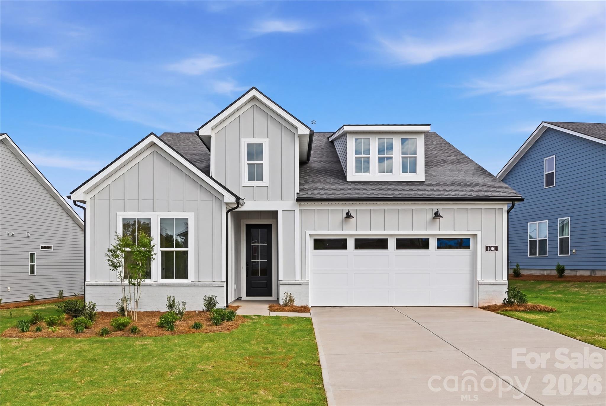 Move-In Ready with Designer-Appointed Finishes Throughout on homesite #213! This stunning Mallard floor plan offers the perfect blend of luxury, comfort, and low-maintenance living in one of the area's premier 55+ communities. Thoughtfully designed with elevated finishes throughout, this home showcases a gourmet kitchen featuring an extended center island, butler's pantry, designer tile, upgraded flooring, and abundant storage.

The open-concept living space is ideal for entertaining, with a beautifully appointed great room that seamlessly extends outdoors through a dramatic 9-foot stacking glass door to the covered rear patio. The well-designed kitchen flows effortlessly into the casual dining area, creating an inviting space for gatherings both large and small.

The private primary suite serves as a relaxing retreat, complete with a spacious walk-in closet and a spa-inspired bath featuring a zero-threshold shower with built-in seat, dual vanities, linen storage, and a private water closet.

Located in The Pines at Sugar Creek, a vibrant 55+ community designed for an active, carefree lifestyle, residents can now enjoy the newly opened resort-style amenity center featuring a clubhouse, fitness center, pool, outdoor spa, pickleball courts, tennis courts, bocce courts, and a full calendar of social activities. Experience luxury living, exceptional amenities, and the convenience of a move-in ready home—all in one remarkable package.