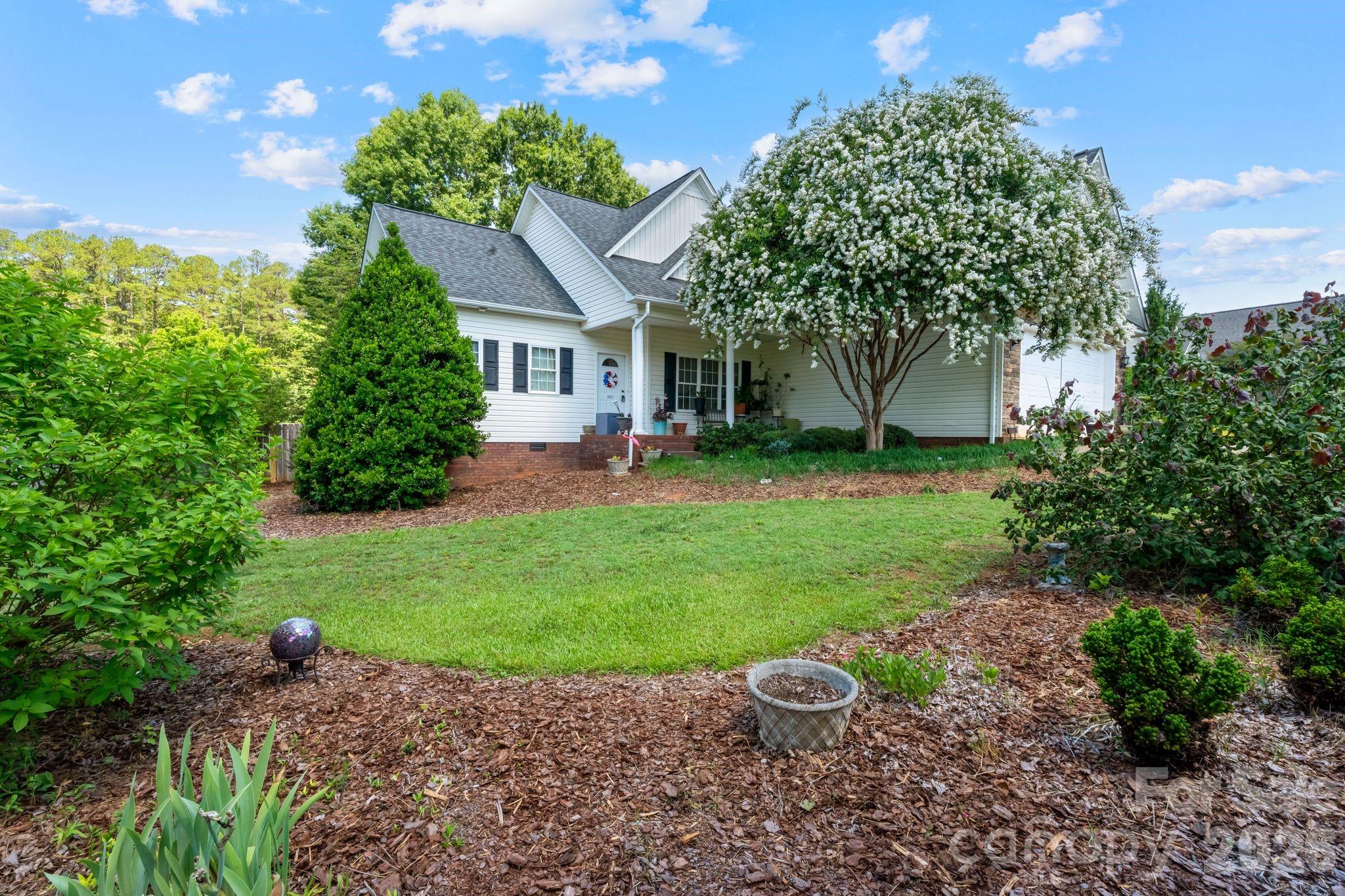 Welcome home to this beautifully maintained 1.5-story home built in 2011 offering sought-after main-level living with 3 bedrooms, 2 full baths, and a spacious bonus room that could easily serve as a 4th bedroom, home office, or flex space! From the moment you step inside, you’ll appreciate the inviting open feel created by the 9-foot ceilings and rich 5-inch hardwood flooring throughout the living room, dining, and kitchen. Designed with both style and functionality in mind, the kitchen features stainless steel appliances, warm wood cabinetry, glass tile backsplash, pantry, and direct access to the oversized 12x16 deck—perfect for entertaining or enjoying the view of the fully fenced, level backyard. The desirable split-bedroom floor plan provides privacy and comfort, while the separately climate-controlled upper bonus room offers year-round versatility. The spacious primary suite serves as a true retreat with a walk-in closet, double vanity, soaking tub, and separate shower. Both bathrooms feature ceramic tile flooring and double vanities, and the laundry room continues the durable tile finishes. Additional highlights include a double attached garage with level entry, excellent curb appeal, and a location that offers convenience without sacrificing peace and quiet. Located less than 6 miles from downtown Newton and just minutes from shopping, dining, and everyday conveniences, this home is move-in ready, neat as a pin, and USDA financing eligible—making it an opportunity you won’t want to miss!