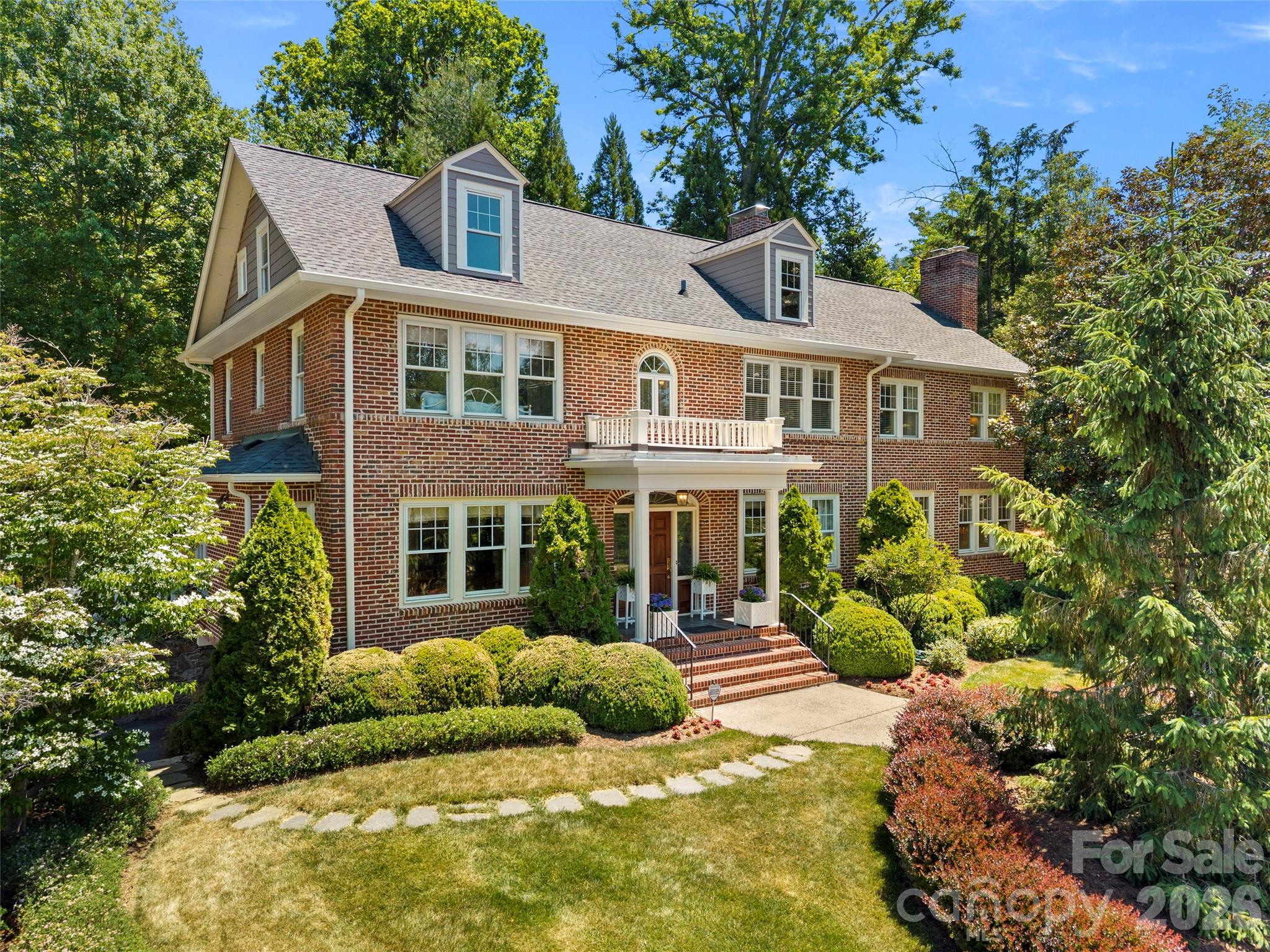 Located in the coveted Rose Garden section of Asheville’s highly sought-after Grove Park neighborhood, this exceptional brick residence blends timeless appeal with thoughtful updates designed for today’s lifestyle. Meticulously maintained and carefully expanded, the home showcases beautiful original hardwood floors, classic architectural details, and vintage hardware that reflect its enduring character.

Designed for both entertaining and everyday living, the main level features gracious gathering spaces including a formal dining room, inviting sitting room, and spacious media room ideal for hosting family and friends. A light-filled four seasons room provides comfortable year-round living and opens seamlessly to the recently updated garden and patio - privately elevated above street level for a peaceful, tucked-away feel. Upstairs, the expanded primary suite offers a peaceful setting with an updated bath, while additional guest bedrooms and a versatile flex space provide comfort and flexibility for a variety of needs. The third floor features an expansive bonus area perfect for a playroom, studio, fitness space, or additional storage. Just moments from downtown Asheville, this distinctive home offers convenient access to acclaimed dining, boutique shopping, and the renowned Grove Park area amenities. Beautifully maintained and ideally situated, this is a rare opportunity to own a truly special property in one of Asheville’s most desirable neighborhoods.