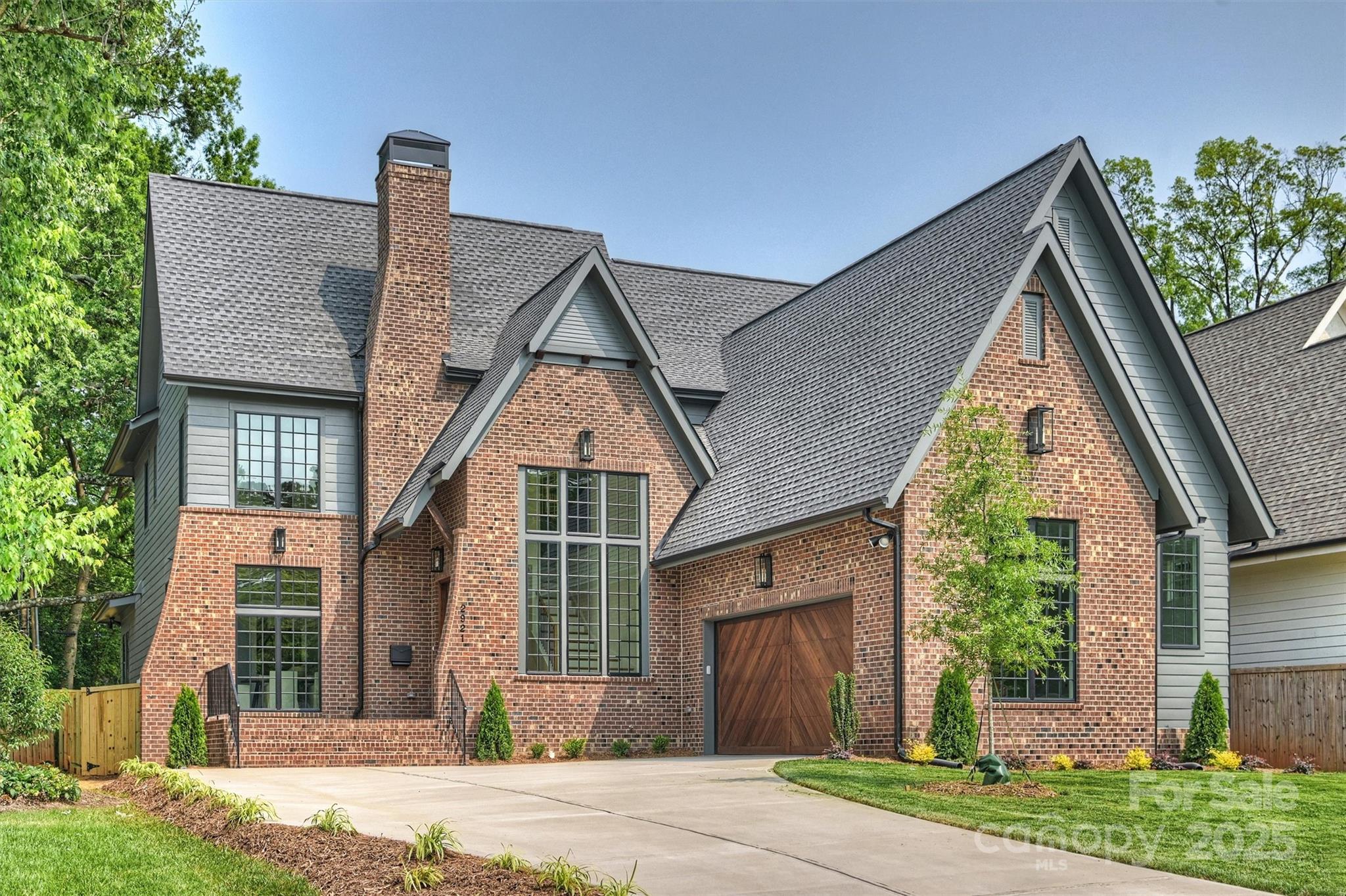 Expertly crafted by Alenky Signature Homes in collaboration with Frusterio Architecture and Crystal Nagel Design, this home is a stunning showcase of thoughtful design and attention to detail. From the moment you step inside, the quality is clear. The layout includes both a formal dining room and a casual breakfast area—perfect for everyday living or gatherings. The chef’s kitchen features custom cabinetry, refined hardware, and a panelized luxury appliance package. A 16' four-panel sliding door connects the Great Room to the covered porch—ideal for relaxing or entertaining—while offering views of the backyard.
The primary suite offers a spacious luxury shower, custom walk-in closet, & convenient laundry area. Upstairs includes four bedrooms—two with en suite baths and two joined by a Jack-and-Jill—plus a generous bonus room for recreation or media. Don’t miss the walk-in unfinished attic for added storage. Located in the heart of Charlotte, this exceptional home is not to be missed.