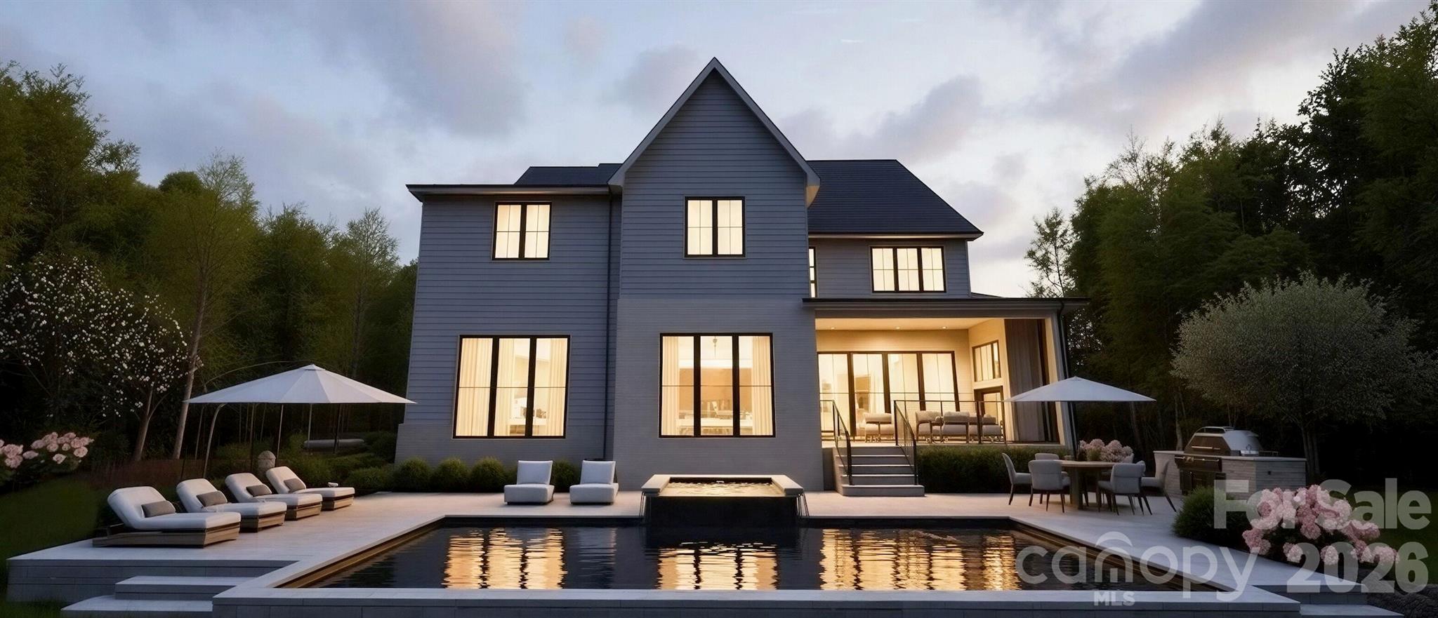 Stunning 5-bedroom, 5.5-bath home located in Providence Park, offering true luxury with a lifestyle built around convenience, connection, and thoughtful design. Crafted for both everyday living and effortless entertaining, this home delivers exceptional flexibility and elevated finishes throughout.
The main level features two private rooms — a true guest suite with private en-suite bath and a separate room dedicated for wellness & lifestyle customization w/ expansive windows providing ample natural light and tucked away just enough if privacy is needed. 
A bright two-story foyer with custom molding opens to an expansive living area with a statement fireplace cast stone fireplace and seamless flow into the dining space and kitchen designed to inspire and entertain.
Tucked away just enough to hide the dishes but seen for it's character is the scullery which includes an ice maker, beverage refrigerator, 2nd Dishwasher & prep sink, creating an ideal setup for hosting and organization. A custom drop zone with built-in desk serves as a functional family command center just off the oversized two-car garage.
Upstairs, the luxurious primary suite showcases a tray ceiling with exposed white oak beams, oversized walk-in closet w/ island, and a spa-inspired bath with an expansive vaulted ceiling detail, custom arch niches around the soaking tub and a huge walk in shower. The upper level is completed with 3 secondary bedrooms, a bonus room with dry bar & included Bev fridge w/ a dedicated media room setup for mood, ambiance,  in-ceiling surround sound,& maximizing entertainment.
Outdoor living has been curated for both outdoor area for running, playing & playground equipment  & entertainment with outdoor kitchen, spa & salt water pool.