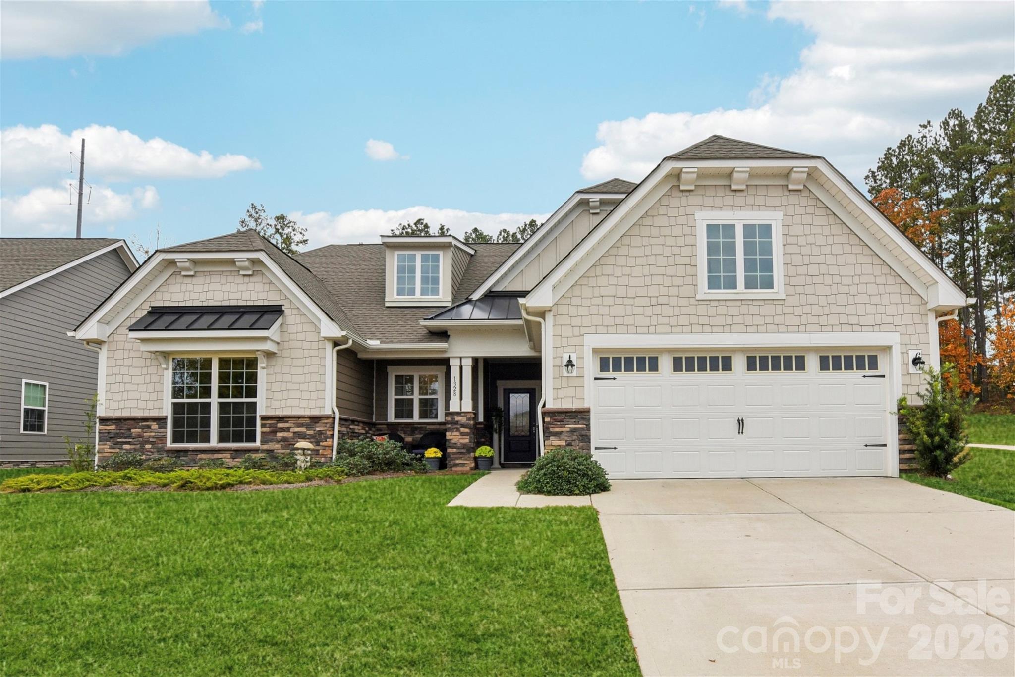 ******NEW PRICE REDUCTION******
Prime lot on Mt Island Lake! 
BOAT DOCKS FOR THE MARINA ARE NEAR COMPLETION! SLIPS TO BE LEASED ANNUALLY. 

This beautifully updated 3BR, 2.5-bath home in vibrant “Imagery on Mt Island Lake” has seasonal water views from the rocking chair front porch and is just steps away from the future marina!
This one level Elmont model on a corner lot will truly become your forever home.

Thoughtful upgrades create a turnkey living experience. The entire house features upgraded luxury vinyl plank flooring providing a cohesive, low-maintenance foundation throughout. Designer window treatments adorn every room, and remote shades add convenience and privacy in the guest room and dining area.

The heart of the home shows exceptional attention to storage and style: a custom kitchen storage system and designer lighting in both the kitchen and dining area make daily living and entertaining effortless. Features include upgraded double wall ovens and a sizeable, pristine quartz countertop.  The primary ensuite includes a custom closet organizer with built-in drawers to keep belongings neat and accessible.  Two additional spaces can flex as guest rooms or serve as an office. The spacious laundry room features a utility sink. There is also Instant hot water at every sink!

The screened-in porch includes a ceiling fan plus privacy sunshades for relaxing outdoors while taking in the beautifully landscaped yard - an entertainer’s dream with a large paver patio, built-in planters, and a sitting wall surrounded by thoughtful landscaping that enhances privacy.  The remote-controlled awning stretches out over the patio for ease and comfort.

Imagery residents enjoy front and back lawn maintenance and the use of outstanding amenities cabins featuring a well-appointed library, textile/art studio, pottery studio and dog park. Care to be a little more active? Take a dip in the heated resort style pool open from May through October! Try your hand at pickle-ball/tennis on lighted courts! The fitness center offers free weights, exercise equipment and a separate studio for yoga, Pilates and even Zumba! Walk the wooded trails to enjoy nature lake-side! There are also over 50 interest clubs in this vibrant community!