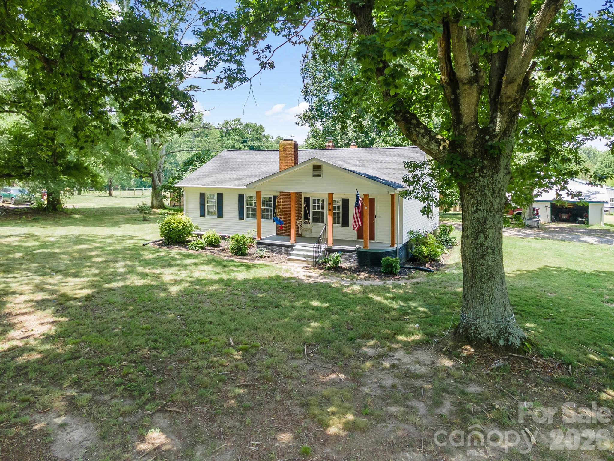 Welcome to 610 Helton Rd! This charming 2-bedroom, 1-bath home also features a bonus room currently used as a bedroom, offering extra flexibility. Enjoy peaceful rural living while staying just minutes from the conveniences of town. Inside, you'll find abundant natural light and a perfect blend of old charm and modern updates. Outside, the detached shop, wired shed, and back carport with a projector screen create endless possibilities for work, storage, and entertaining. Best of all—no city taxes! Come and check out your next home, right here in Cherryville, NC!
