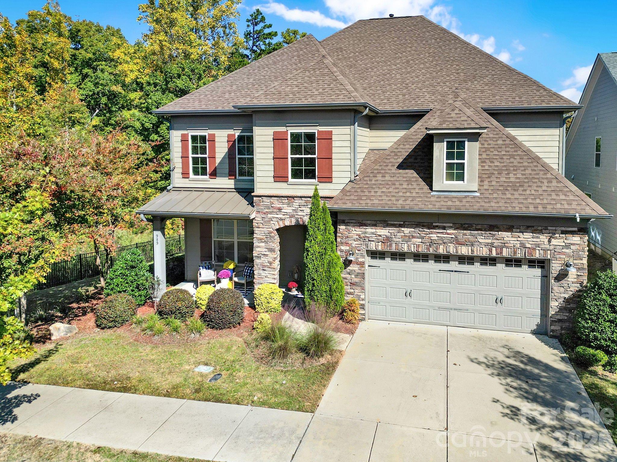 Prepared to be wowed! Open plan w lots of windows bringing natural light to gourmet kitchen w oversized island, 5 burner gas cooktop, double oven, stainless appliances, walk in pantry, open dining w sliding door leading to screened porch. The main floor offers private guest suite and full bath w zero entry shower, office, dining room, welcoming great room, stone fireplace, & flex space off great room for endless entertaining. Upstairs you will find 4 additional bedrooms, 3 full baths, loft, and a bonus/play room w closet and custom blackout shade for movie night. The primary suite features walk-in closet, oversized tile shower, w double shower heads, & custom motorized shades. Hardwoods on main level, tile baths, & carpet upstairs replaced on 2024. Customs shades in all bedrooms. Extensive hardscape/landscaping, gas fire pit, very private yard, w irrigation and water feature. Community offers clubhouse, pool, 2 play grounds, 2 ponds, walking trail, & walk-able to dining options. Welcome home!