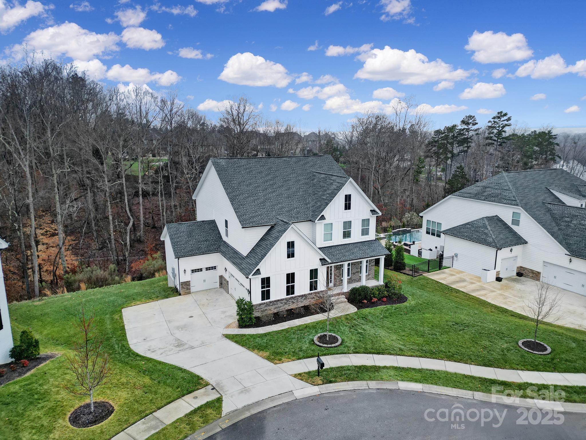 Executive home on a wooded 1/2 acre cul-de-sac lot, provides privacy & convenience w/ top ranked school & shopping close by. Step inside to find the right blend of luxury & modern design. Boasting an expansive open floor plan & high-end finishes. The chef’s kitchen is a culinary dream, featuring top-of-the-line appliances, a large island & white cabinetry, all perfect for hosting a family gathering. The luxurious owner’s suite is designed for ultimate relaxation. The spa-inspired ensuite bath is nothing short of extraordinary, featuring a large tile shower, a freestanding soaking tub & dual vanities. Enjoy the wildlife show from the screen porch. The expansive 1600+ sf unfinished basement offers incredible potential for customization. With electrical & rough-in plumbing in place, it’s ready to be transformed into a custom home theater, gym or additional living space. 3 Car Garage. Rich amenities include clubhouse, pool, gym, tennis, pickleball, basketball, playground & walking trails.