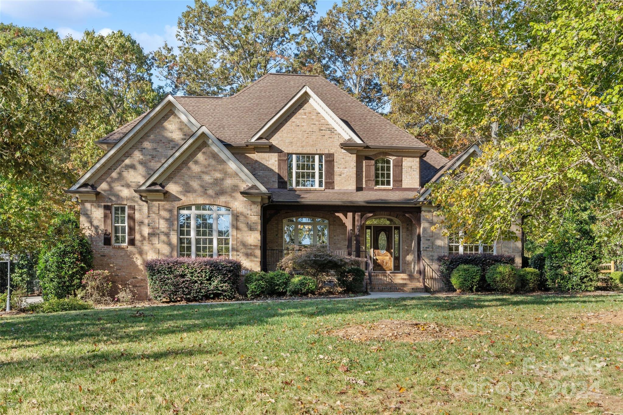 Resting amongst the mature hardwoods in beautiful Lake Wylie you'll find 5677 Lake Wylie Road! A stunning example of the mid 2000's(2007) all brick architecture with just over 3540 square feet of living space! The primary bedroom suite is located on the main floor with dual walk in closets & primary bathroom that is truly a dream to behold! Also on the main amongst beautiful hardwood floors & stunning trim work you'll find a formal office, dining room, Chefs kitchen & breakfast area & a keeping room with the coziest gas fireplace! Lets not forget the two story great room large enough for all of your favorite entertaining festivities with built-ins & another gas fireplace! Upstairs we find one on-suite with full bath & two additional bedrooms sharing a full Jack & Jill bathroom. Car lovers, A true 3 car garage! Huge backyard with plenty of room for a pool! Convenient to shopping with easy access to Lake Wylie, Rock Hill, York, & Charlotte. Low SC taxes & Clover Award Winning Schools!
