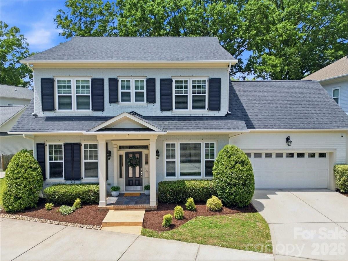 Welcome to this beautifully crafted, stunning 5 bedroom, 4.1 bath home in the desirable Cotswold neighborhood!  Built in 2016, this thoughtfully designed residence offers over 3,300 square feet of light-filled living space with timeless finishes and an ideal floorplan for both everyday living and entertaining.  Step inside to discover soaring 10-foot ceilings, gleaming wood floors, and an open-concept main level centered around a spacious family room with a gas fireplace. The chef’s kitchen features creamy 42" cabinetry, stone counters, stainless steel appliances including a five-burner gas cooktop, oversized island seating, and a walk-in pantry~ all seamlessly connecting to the dining and living areas.  The main-level primary suite provides a private retreat with dual walk-in closets and a spa-inspired bath with oversized walk-in shower, soaking tub and dual vanities with abundant cabinetry. Upstairs, four additional bedrooms, multiple full baths, and generous attic storage offers flexibility for guests, office space, or growing households. The outdoor living shines with a private screened porch, expansive paver patio, lush tree canopy, fenced backyard, and oversized, attached two-car garage.  Ideally located just minutes from Uptown's Center City, Cotswold shopping and dining, SouthPark and top Charlotte destinations~ This home combines modern comfort with classic Charlotte charm in one of the city’s most sought-after locations!  Don't miss this one!
