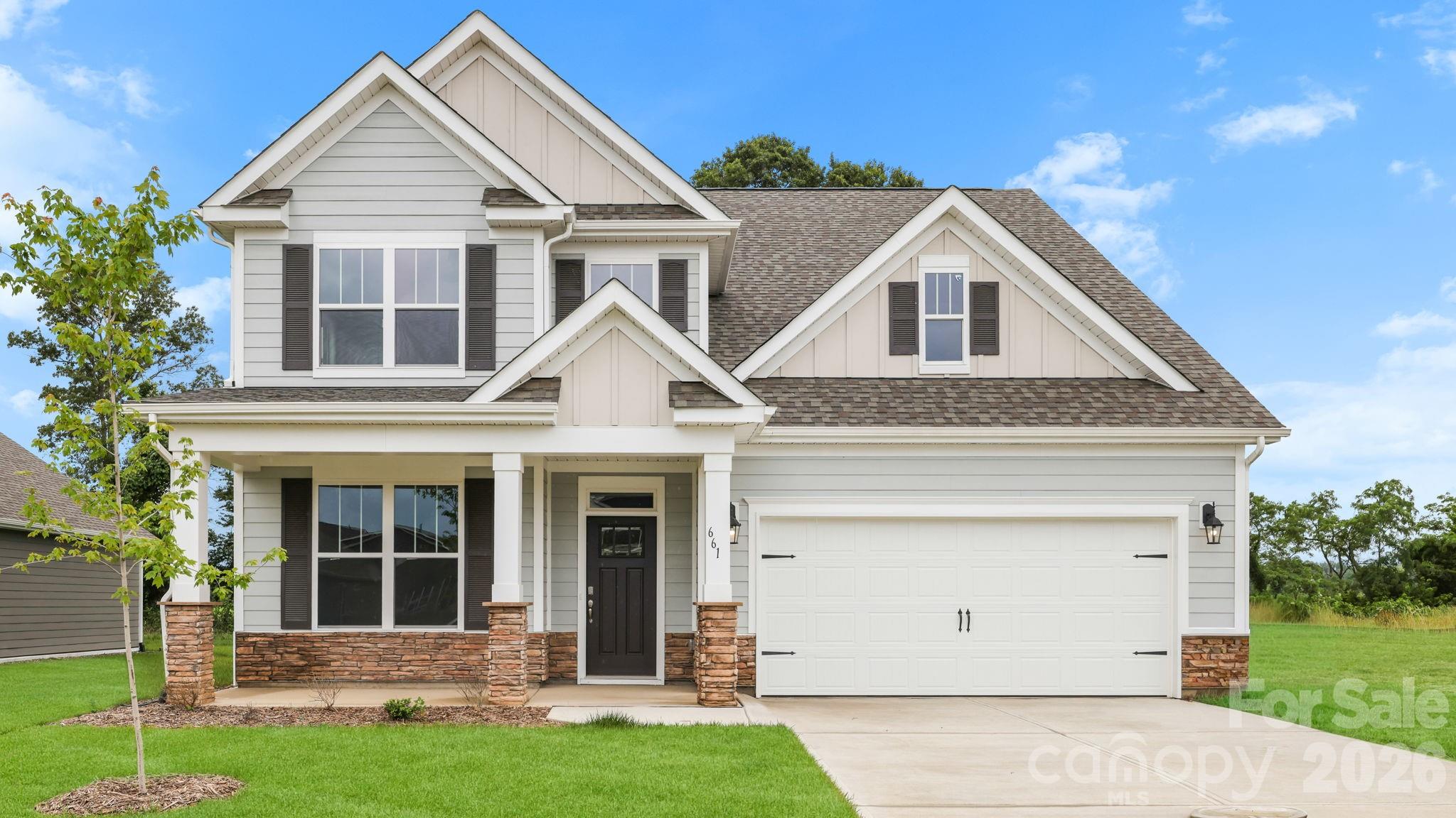 Tap Root Farms is a master planned community in Fletcher, NC featuring well-appointed single level and 2-story homes. Community features will include a 5,000 square foot resort style clubhouse with gym, large pool, playground, pickle ball courts and dog park. This new construction home is complete and ready for its first owner! The Windsor is a popular floor plan with plenty of space to meet your needs! With 4 bedrooms, a two-car garage and loft area, this well thought out home has it all! The large, open kitchen has beautiful countertops, tile backsplash, ss appliances, walk-in pantry and breakfast bar. Around the corner, you will find the conveniently located laundry area. The primary suite is located on the main level with ensuite bathroom, including a double vanity, privacy toilet closet and generous walk-in closet! *Home features are subject to change without notice. Internet service not included. Sq footages are approximate*