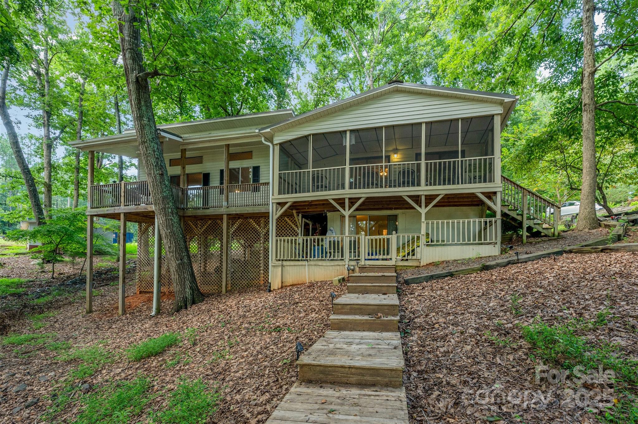 Escape to this charming 3-bedroom, 2-bath lakefront home. Ideal for both relaxing getaways and full-time living. With a private boat lift and pier, you’ll enjoy easy access to the water for boating, fishing, and swimming. The screened-in deck offers a peaceful spot to take in the lake views, while the fully finished basement provides extra space for entertaining, working from home, or hosting guests. Thoughtfully designed and comfortably equipped, this home has everything you need for a weekend retreat or year-round residence. Whether you're looking to unwind for a few days or settle into lake life permanently, this property offers the perfect blend of comfort, convenience, and natural beauty.