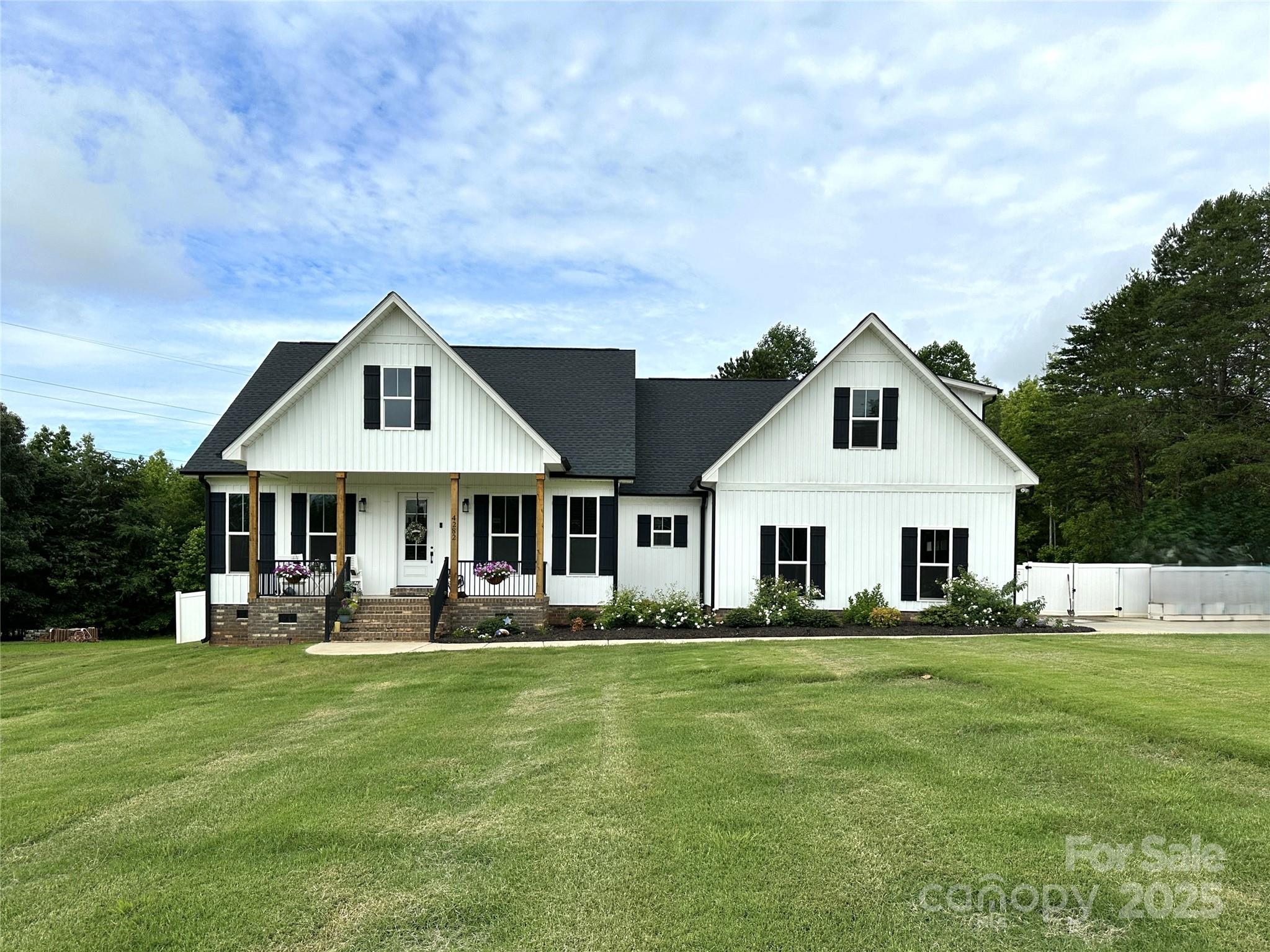 BEAUTIFUL, BETTER THAN NEW HOME ON NEARLY 2 ACRES! GORGEOUS CHEFS KITCHEN W/ LARGE ISLAND FEATURING QUARTZ COUNTERTOPS, SS APPLIANCES, TILE BACKSPLASH, GAS COOKTOP & TONS OF CABINET SPACE. HUGE WALK IN PANTRY ALLOWS FOR AMPLE STORAGE. OPEN FLOORPLAN W/ GLEAMING HARDWOOD FLOORS & 10 FT CEILINGS THORUGHOUT MAIN LEVEL. GAS FIREPLACE SURROUNDED BY BUILT IN SHELVING. VAULTED CEILINGS IN KIT & GREAT ROOM, EXPOSED BEAMS & PLANTATION SHUTTERS ALONG FRONT OF HOME. LARGE PRIMARY SUITE FEATURES HARDWOOD FLOORS & A WALK IN CLOSET W/ BUILT IN ORGANIZER. STUNNING PRIMARY BATH BOASTS DUAL VANITIES W/ QUARTZ COUNTERS & STYLISH BRUSHED GOLD FIXTURES. TILED SHOWER W/ GLASS SURROUND & A LARGE FREESTANDING TUB. SPACIOUS SECONDARY BEDROOMS W/ WALK IN CLOSETS. UPPER LEVEL FEATURES A FOURTH BEDROOM/BONUS RM W/ FULL BATH.  OUTSIDE LIVING AT ITS FINEST W/ A BEAUTIFUL STAMPED CONCRETE PATIO, TWO SPACIOUS COVERED PORCHES, A FENCE, BEAUTIFUL LANDSCAPING & A GORGEOUS MANICURED LAWN. THIS HOME IS A SHOW STOPPER!