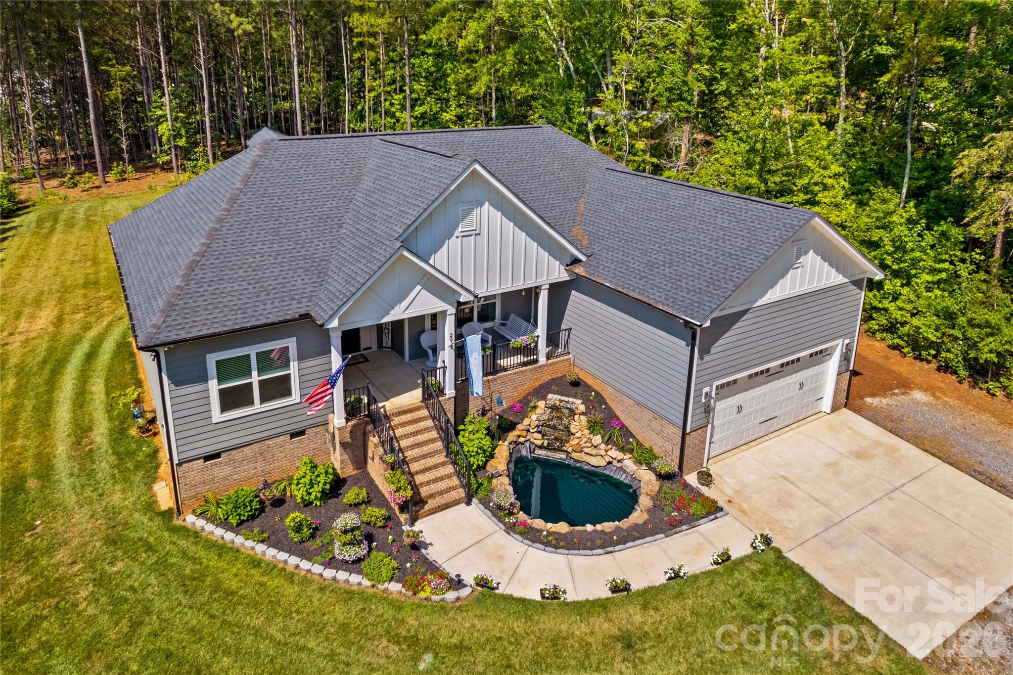 Beautifully maintained, custom RANCH, open floor plan, lots of windows, natural light & neutral colors throughout. The open great room & kitchen feature a vaulted ceiling, gas FP, granite countertops, SS appliances, lots of cabinetry & a HUGE kitchen island! Split bdrm floor plan, with the laundry room connected to the primary bdrm/bath. Unique barn doors grace the office & primary bathroom. Septic is for 3 bdrms, but the office could be used as a 4th bdrm, playroom, workout room, etc...  The oversized garage has plenty of room for added storage. Enjoy quiet mornings on your "rocking chair" front porch & BBQ's on your back deck. Lovely koi pond & fountain is located in the front yard. Sought after North Lincoln school dist.  Country living with city conveniences.
Septic lines are located in the front yard, repair area is in the back.