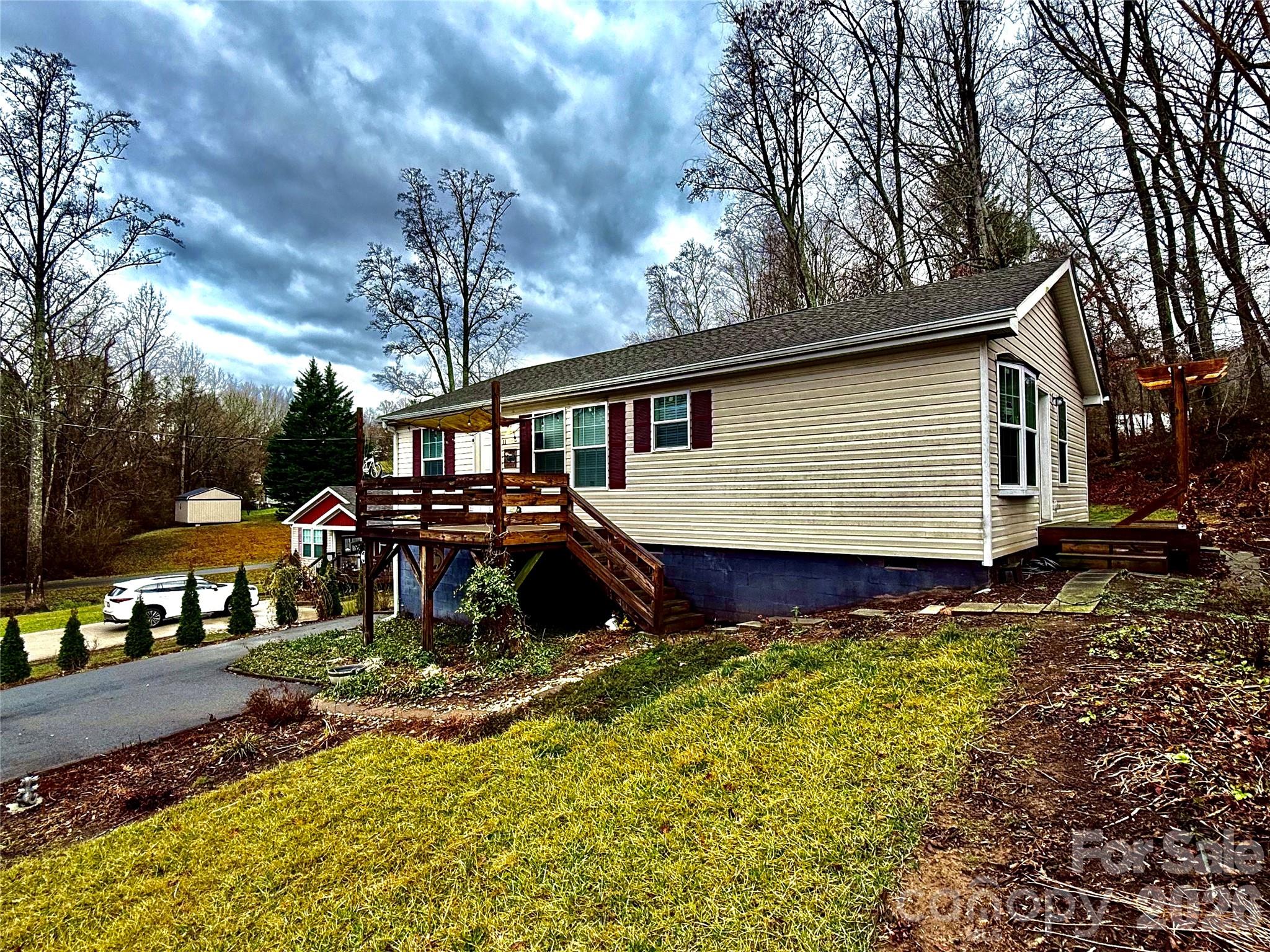 Located in West Asheville just beyond city limits and at the base of the 342 acre "LARGEST PARK IN BUNCOMBE COUNTY" at Deaverview Mountain, coming soon!  This 3BR/2BA home offers the best of both worlds, lower taxes, airbnb permissible and quick access to town. Inside, you’ll find an effortless layout with a generous primary suite featuring a double vanity and large garden tub. Step outside to a large, sunny yard with garden beds, ready to come alive in the spring. Simple, functional, and in a location that will likely see big gains in value as Deaverview Mountain Park comes alive.  Get it while the gettin's good!