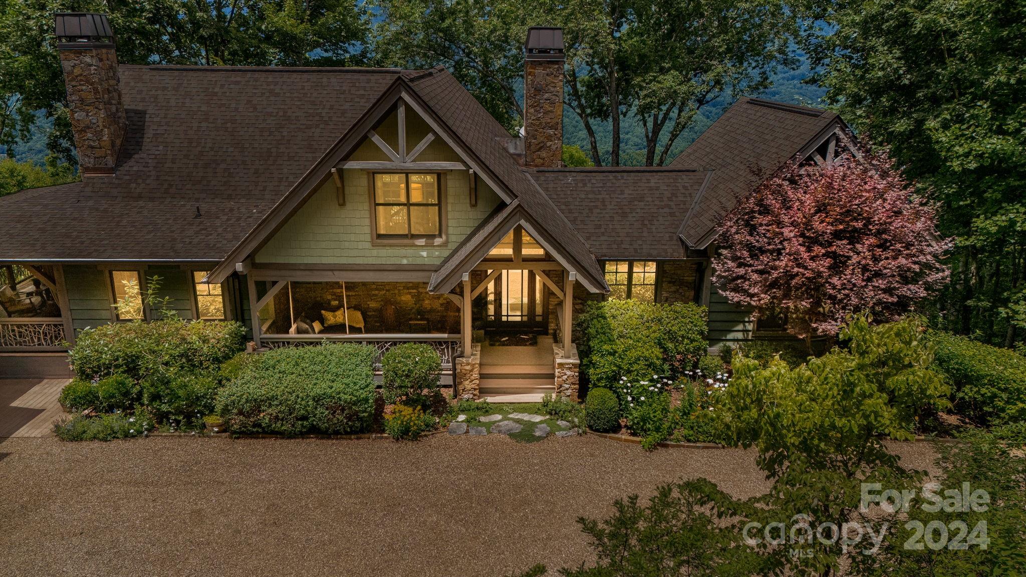When you enter this meticulously maintained home, you will be greeted with some of the most spectacular views in Western NC. Featuring vaulted wood ceilings, multiple gorgeous stone fireplaces, beautiful heart pine floors and large windows throughout, it feels like a true mountain retreat. The open floor plan flows out onto incredible covered porches and decks making this home perfect for entertaining. With four generously sized suites and a bunk room, there is room for all of your friends and family to enjoy this paradise. The impeccable landscaping welcomes you to a flat driveway, an oversized auto court, and a 2 car garage, all of which can be challenging to find in the mountains. The ultimate highlight is the main covered porch, which features a wood burning fireplace, soothing sounds of a waterfall and epic sunsets.While taking in the cool summer air above 3,600 feet, you will never want to leave. Balsam Mountain Preserve is a private club community with fully completed amenities.