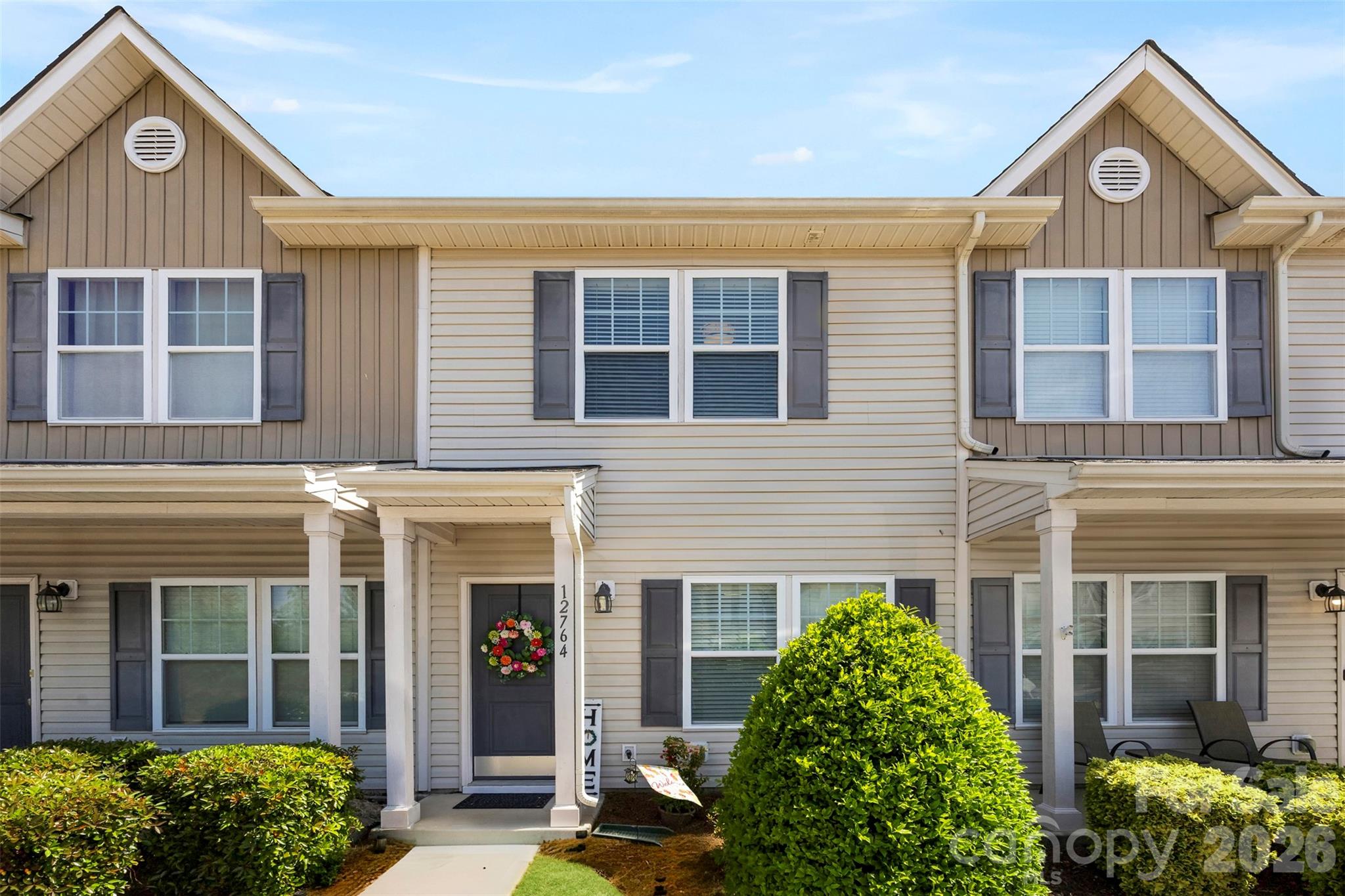 Welcome to 12764 Persimmon Tree Drive, a well-maintained townhome in the Steele Creek area offering 2 bedrooms, 2.5 bathrooms, and 1,160 square feet of comfortable, move-in ready living space.  The main level features an open, functional layout filled with natural light, creating an inviting space for both everyday living and entertaining. The spacious living area flows seamlessly into a well-appointed kitchen with ample cabinet and counter space, making it both practical and easy to enjoy. A convenient half bath is also located on the main level for guests.  Upstairs, both bedrooms offer privacy and convenience, each with its own full bathroom. This layout works well for roommates, guests, or a dedicated home office, providing a comfortable separation of space while still feeling connected and efficient.  Step outside to a private rear patio, perfect for relaxing, enjoying your morning coffee, or unwinding in the evening. Recent updates include fresh paint, brand new carpet, and new flooring in the bathrooms, giving the home a clean, updated feel throughout.  The home has been well cared for and offers easy, low-maintenance living. Conveniently located just minutes from shopping, dining, and everyday conveniences, with quick access to I-485 and I-77 for an easy commute. Close proximity to Charlotte Premium Outlets, RiverGate, Lake Wylie, and Carowinds provides plenty of options for entertainment and recreation.  A well-kept home offering simplicity, convenience, and a location that continues to see steady growth.