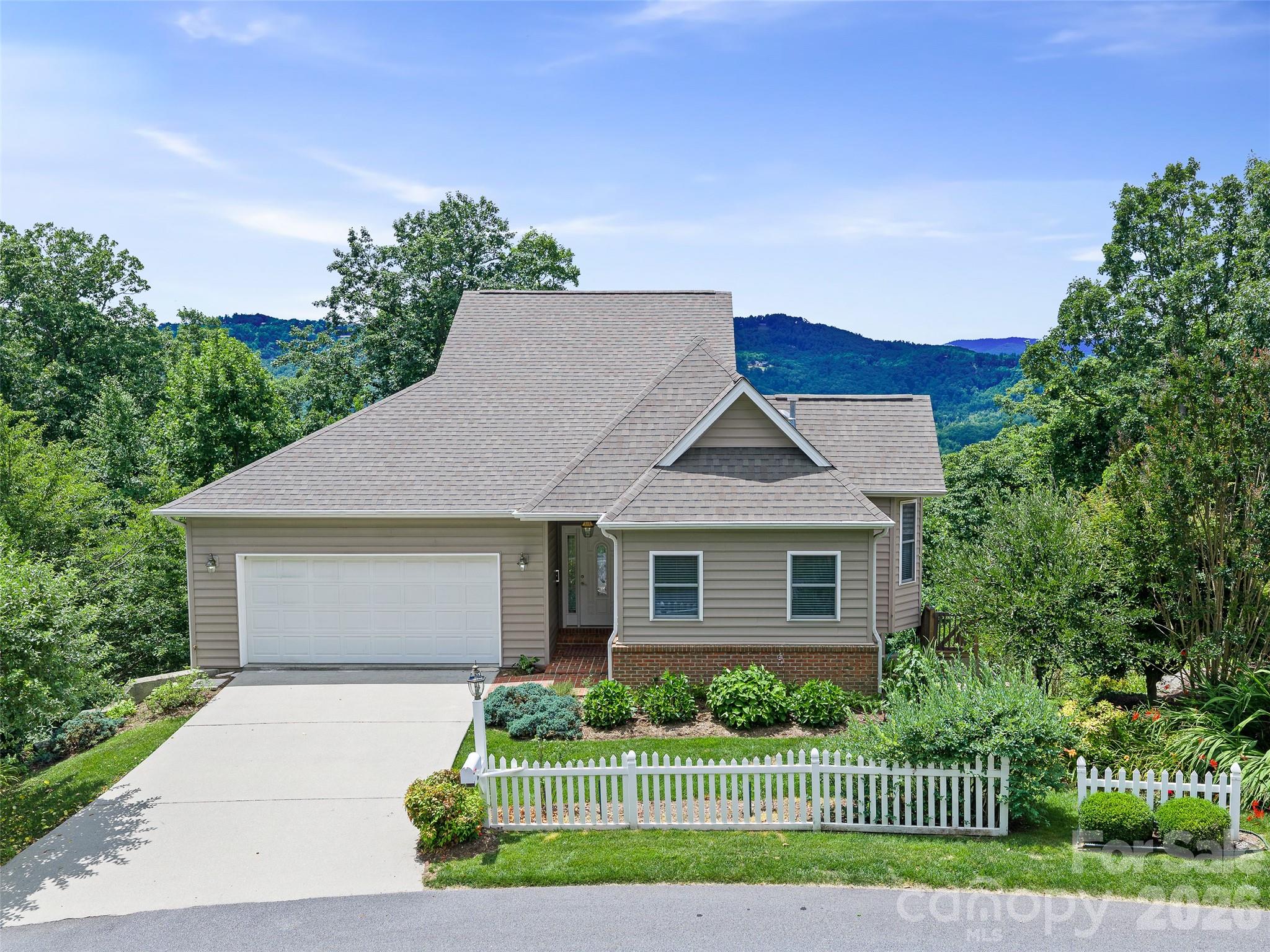 Perched to capture breathtaking, year-round panoramic mountain views, this beautifully maintained one-owner home in the highly sought-after gated community of Carriage Park offers an exceptional mountain lifestyle. From the spacious back porch, take in sweeping long-range vistas of Jump Off Mountain and Jeter Mountain—a stunning backdrop for morning coffee, evening sunsets, and every season in between.

Built in 2006, this thoughtfully designed home features a desirable one-level living floor plan with a full basement, providing everyday convenience and abundant storage. The main level includes direct access from the attached two-car garage, a well-appointed kitchen with granite countertops and GE Profile appliances, a cozy fireplace, a spacious primary suite, and a convenient main-level laundry room. The washer, dryer, refrigerator, dual fuel stove with two ovens, dishwasher, and microwave all convey, making this home truly move-in ready. A stair lift is also included for added comfort and accessibility.

The expansive lower level offers exterior access and provides the perfect space for a workshop, hobby room, fitness area, or additional storage. An attached garage, concrete driveway, and easy main-level entry further enhance the home's functionality.

Life in Carriage Park offers more than just spectacular scenery. Residents enjoy an impressive collection of resort-style amenities, including a welcoming clubhouse, year-round indoor pool, tennis/pickleball courts, a scenic community pond, and the peace of mind of a 24-hour manned gated entrance.

Rarely do homes combine effortless main-level living, outstanding community amenities, and unforgettable long-range mountain views so beautifully. Don't miss this opportunity to own your own piece of Carolina mountain paradise.
