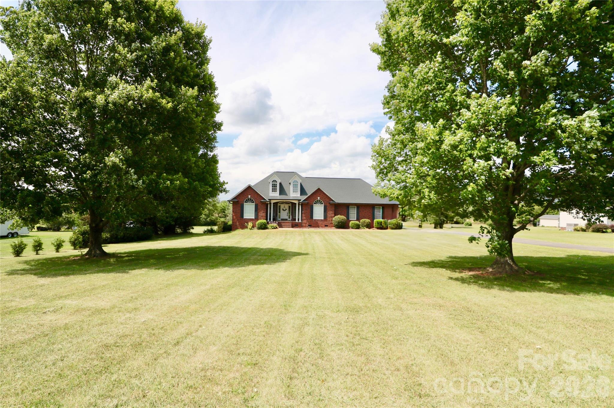 Charm, comfort, and convenience come together in this beautifully renovated ranch home. Ideally located just minutes from I-77 and a short drive to Charlotte, this home offers easy access for commuters while still providing the space and feel of peaceful living.

Inside, you’ll find an inviting open-concept layout filled with natural light and thoughtfully updated finishes throughout. The main living area features beautifully refinished hardwood floors and a stylishly updated kitchen with quartz countertops, refreshed cabinetry, and stainless steel appliances, making it perfect for both everyday living and entertaining.

The spacious primary suite offers a relaxing retreat, complete with a beautifully updated bathroom featuring an oversized walk-in shower with marble tile and a built-in bench for added comfort. A large walk-in closet provides generous storage and plenty of room for organization.

Downstairs, a finished basement with a full bath offers incredible flexibility. Ideal for a second living area, home office, guest space, recreation room, potential in-law suite, or whatever you want!

Additional features include an attached 2-car garage with storage, plus a large detached garage/workshop at the edge of the property, which makes it perfect for hobbies, extra storage, or recreational equipment.

Situated on a spacious lot with both large front and back yards, this home offers plenty of room to relax, play, garden, and create lasting memories for years to come.
