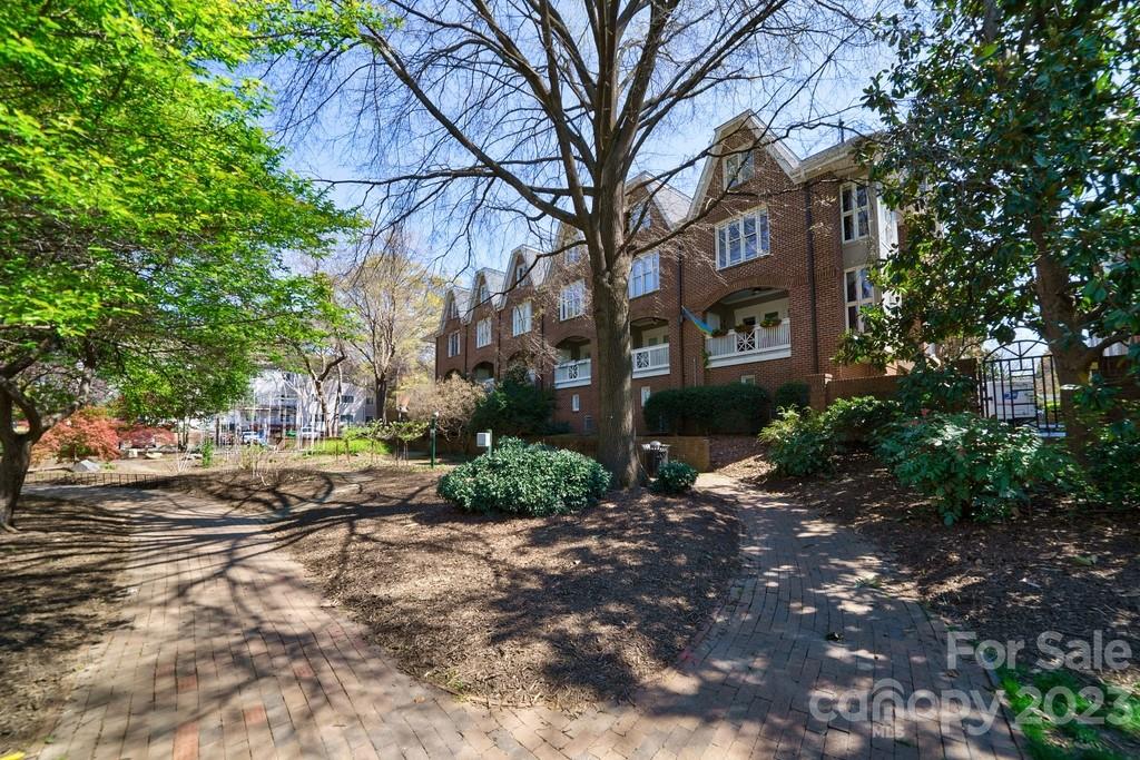 There are few opportunities to own a home just blocks from all of the energy and excitement of the center of the city and yet feel like you are living in a leafy green retreat.  This elegant brick townhome overlooks the lush 4th Ward park.  The covered balcony is a quiet  place to enjoy your morning coffee or an end of day beverage as you watch the sun go down through the mature trees. A short walk takes you to neighborhood hangouts like Alexander Michaels or so much in the city including pro teams, theater and world class restaurants.  The home is pristine and features true hardwoods, a sunny kitchen with custom stone backsplash and granite counters.  There is an oversized 2 car garage with extra storage which is a rare find in Center City.  This intimate enclave of just 20 homes is a sought after community within the urban center. The 3rd level is a spacious bedroom with a third bath and would be an excellent spot for a private retreat or space for an au pair. Come take a look!