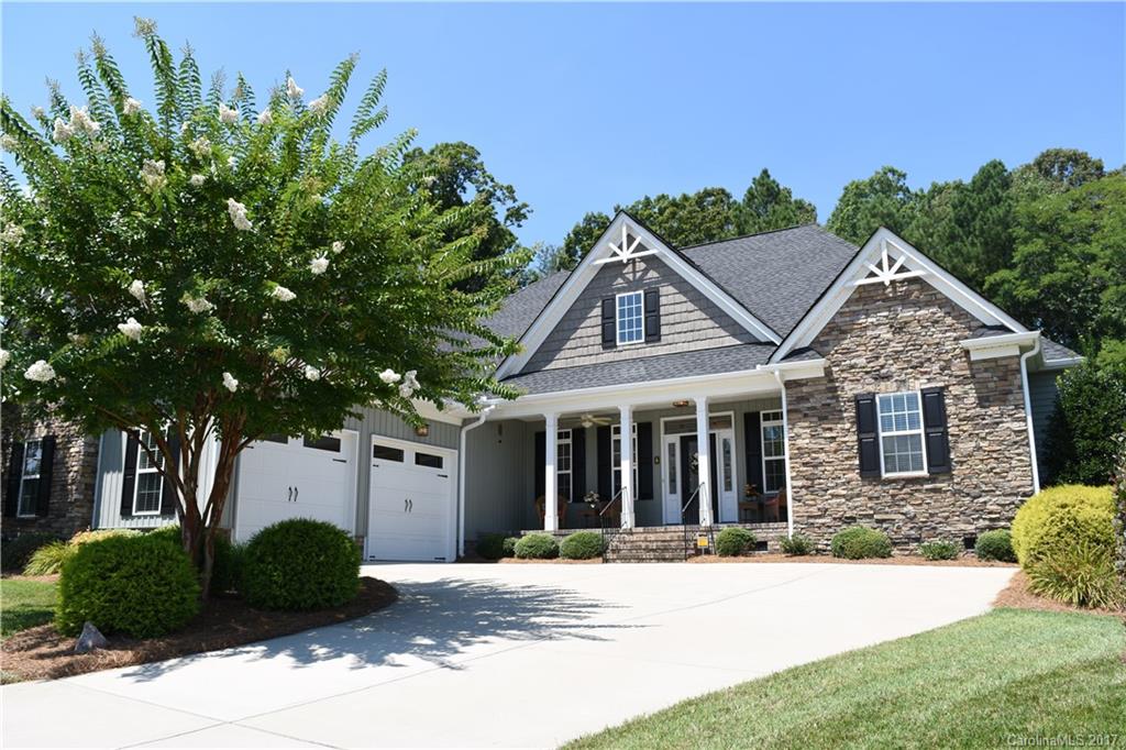 Gorgeous transitional ranch home on private lot in Seven Oaks Subdivision, Rock Hill, SC! Rocking chair front porch! Custom built open floor plan 2437 SF home w/gorgeous hickory HW floors! Beautiful crown molding, upgraded cabinets, gas cooktop, 2-level kitchen island & 2 pantries! Gas FP in LR! Master BR has soffitt ceiling, opens to screened porch and has an unbelievable walk-in closet! Master BA has exquisite walk-in shower, double vanities &  Caesar stone counters! Comm. Pool. Home Warranty!
