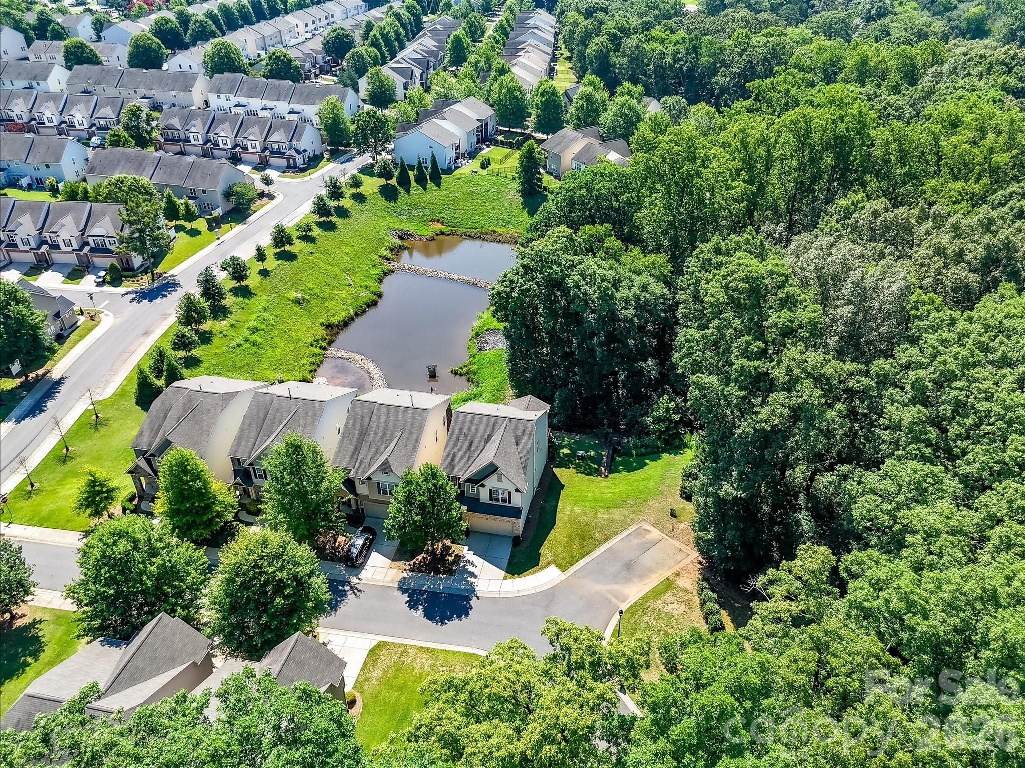 Rare opportunity to experience POND VIEWS and nature at its best in gated ParkSouth Station! Signature street offers premium cul-de-sac location in highly desirable, amenity-rich neighborhood. Modern 2-story basement home is nestled among the trees and overlooks one of two tranquil neighborhood ponds. This home boasts a dynamic floor plan with glamorous features at every turn. Designer-curated light fixtures. Fresh paint throughout. New carpet. Gourmet kitchen with 36" gas cooktop, large granite island, stainless steel appliances and 42" cabinets! Spacious Upstairs Bedrooms and a Primary Bedroom Suite with tray ceiling, spa-like bathroom and walk-in closet. Washer, dryer are less than a year old and will convey. Finished basement offers a Family Room, Flex space, Full Bath and private Guest Suite that opens to covered patio. All day, every day, you will be so happy to call this abode home! Sunchaser Lane offers great space for cul-de-sac gatherings, paved play space, and an abundance of parking for guests. Fabulous community features sidewalks, Jr. Olympic pool, dog park, fitness center, club house and more.