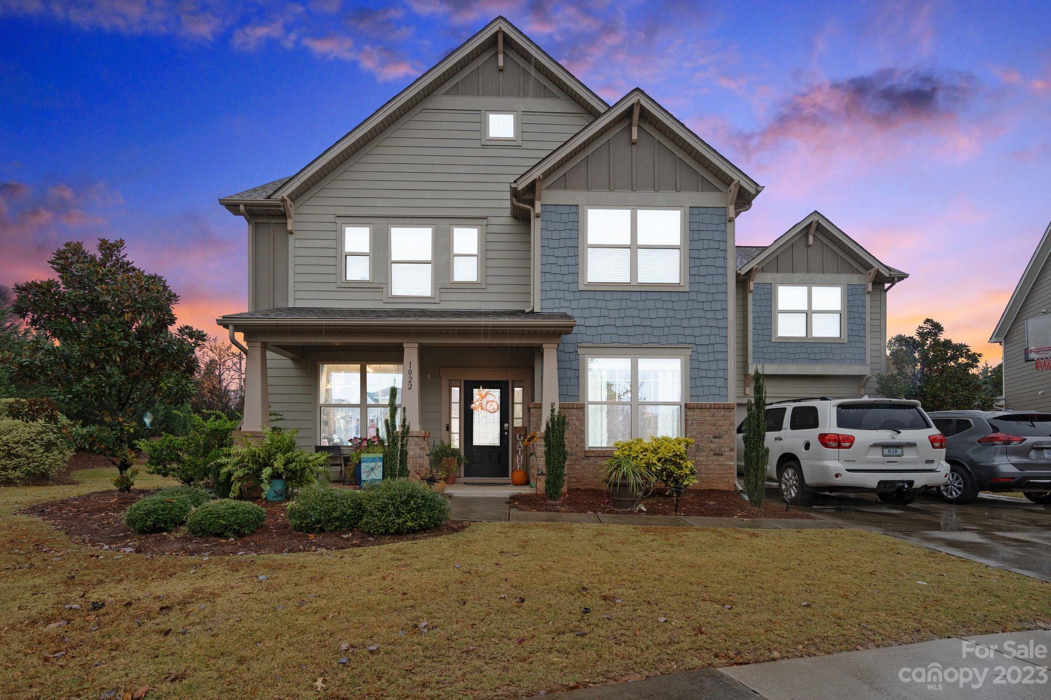 As you step into this charming abode, you'll be greeted by an inviting ambiance that's bound to captivate your heart. The stunning exteriors of this home, coupled with the perfectly trimmed greenery, are sure to make a lasting impression. The gorgeous kitchen features modern appliances, polished countertops, chic lighting fixtures, and a lovely island for cooking or eating. On this floor, you'll also find a vast family room, a formal dining room, a guest bedroom with its own bathroom, an office, a laundry room, a sunroom, and a sun porch. Upstairs, you'll find sizeable bedrooms, each with its own bathroom for maximum privacy. Check out the primary suite, complete with its cozy fireplace and sitting area. The surprises continue outside the property, with the charming outdoor fireplace and fenced-in yard. Located in a sought-after community, you'll have access to a clubhouse, tennis courts, a walking trail, and a well-equipped gym, and be close to award-winning schools.