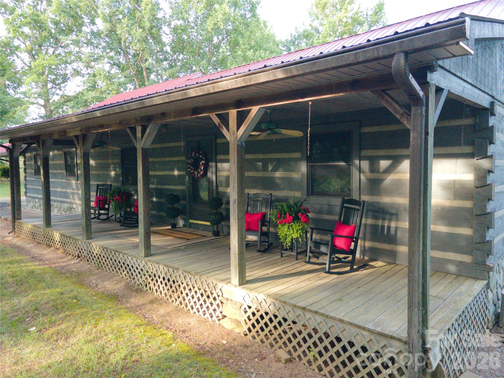 A 66+acre property with a main house, a second living quarters (cabin) and a caretaker's cottage nestled in a fabulous setting in Northern Iredell County. This property borders Rocky Creek on the west side and offers incredible views from existing homes and hilltops. See for miles from the crest of the hilltop! This is a unique opportunity to own the property of a lifetime. Sit on your front porch and watch the horses/cattle graze, listen to the bold Rocky Creek babble below, feel the breezes and take it all in. The two story home address is 144 J and W Drive. It is wood-sided,3BR/2BA with double garages for a total of 4 car attached garage. Hardwoods, gas log fireplace, great property views from all sides of this home. Two large metal shops at rear of home that include a mechanic's lift. Second living quarters, aka the "Cabin" is 179 Jand W Drive(2196'on main and 1208' bsmt). It has solid log walls on the first floor with primary bedroom on main floor. Front porch overlooks Rocky Creek and is covered for enjoyment in all types of weather. It's walk-out basement has served as a second bedroom, holds a second full bath and laundry. Caretaker's cottage at 301 Tatum Road (1248 sq ft)provides another 2 BR abode with a full bath. Septic records could not be obtained for cabin and cottage. Also listed as MLS No. 4342345.
