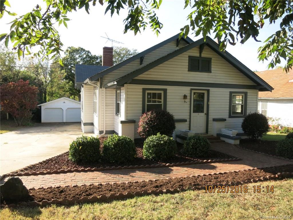 Older home features original hardwood floors in great condition and enclosed front porch. Living room(closed FP), formal dining room, den with wall storage could be bedroom but has no closet. Basement with outside access was used as wood working shop. Detached garage is 20 X 22