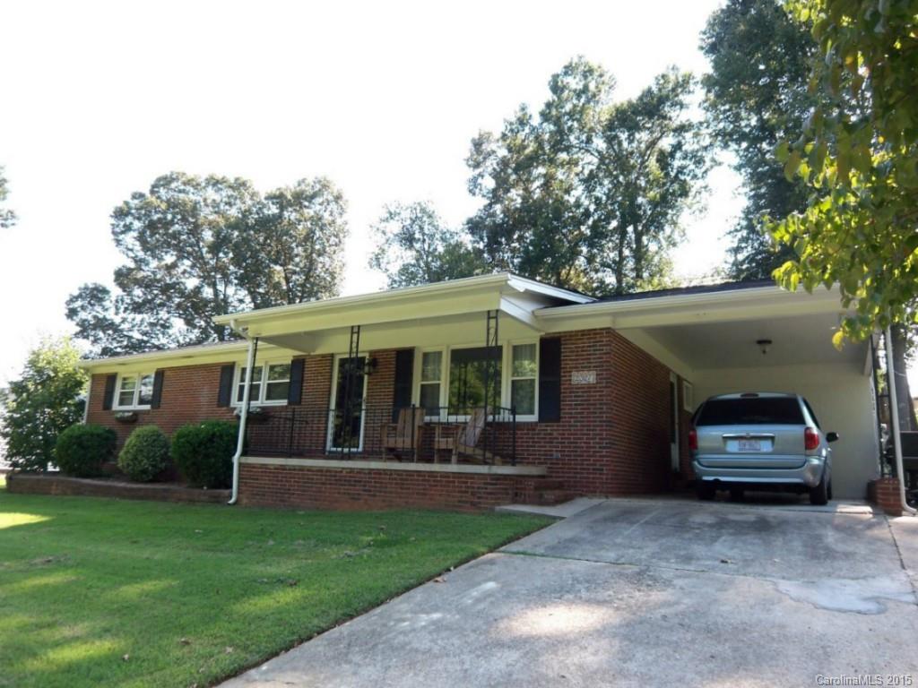 All brick ranch on large lot with many shade trees & screened porch. 3 bedrooms. Owner's suite shares Jack n Jill
bath with hall bath. Large living room w/hardwood floors. Big dining room off kitchen. No carpet in house. New
roof & gutters. Newer windows & paint. Updated Kitchen and bathroom.  All updated lighting. Storage shed w/electricity in yard. Storage unit off 1 car carport. Fenced yard.