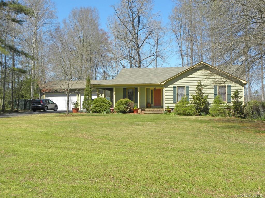 Your haven in the country! Lovely sunroom overlooking a cow pasture in this beautiful country setting. Wrap-around porch, fenced yard w/ garden shed & outbuildings (even a chicken coop!) Ranch home on 1.6 acres, easy-flowing floorplan. Formal dining w/ Wainscoting, plus bfast area with view of the pasture. You'll love the cozy kitchen, mudroom and spacious laundry! Master has dressing area w/ double vanity, nice walk-in closet. 3-car detached garage w/AC&heat. Convenient to town, Clover schools!