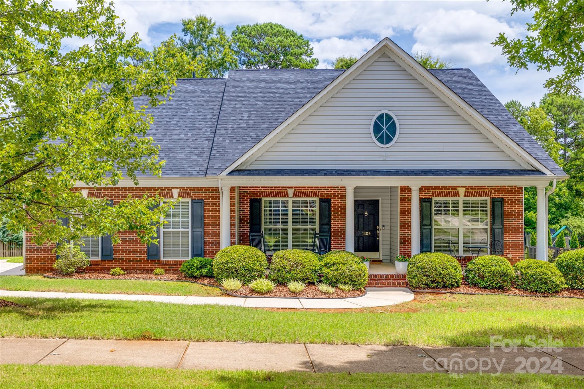 Welcome to Shade Tree Court- a beautiful tree lined street situated on a cul-de-sac in Lindenwood.  This charming 1.5 story sits on over .5 acres with a private back yard.  The covered front porch greets you with the perfect spot to relax & enjoy your morning coffee.  Inside, an abundance of windows & natural light make this space light and bright.  Great floorplan that features a dining room or potential office area off the foyer. The kitchen has a separate breakfast nook, 42 inch cabinets, refrigerator, granite countertops, gas range, and overlooks the great room with a high vaulted ceiling. Take in the scenic backyard views from the sunroom and outdoor deck area. Large primary suite has a tray ceiling, dual vanities + walk in closet. Down a separate hall, there are 2 guest bedrooms, an additional full bath, & laundry room. The upstairs bonus with full bath is perfect for guests, or a flex area.  Great location right across from the Village Commons Shopping Center. Don't miss this!