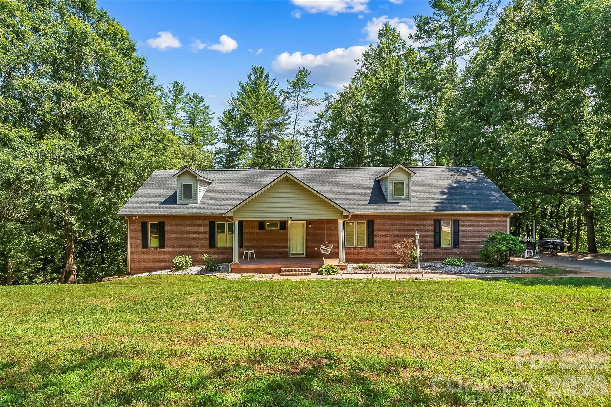 Serene and sprawling, this 2BR/3.5BA gem of a home is nestled in beautiful Granite Falls and features a full, finished basement, updated kitchen and access to the Little River! The beautiful kitchen features granite countertops, a large island, tile backsplash, pantry, stainless steel appliances and is open to the spacious living room, which features a brick fireplace and beautiful large windows.The dining room is open to the kitchen, creating a great flow for entertaining. A large sunroom sits off the living room, offering gorgeous view of the large backyard and the Little River. The spacious primary bedroom with large primary bath has a walk-in shower, jetted tub, double sinks and linen closet. Second bedroom features board and batten accent wall and updated full bath. Multiple closets throughout the main level and additional half bath. Laundry on main. Full, finished basement offers the perfect space for a mother-in-law suite or extra space for hobbies. Basement features a kitchenette, storage cabinets, dining area, den area, full bath, and multiple storage areas. Indoor pool has been floored over, creating a large and bright flex space, ready for customization! Beautiful deck wraps around the back of the home. Enjoy wading, swimming and splashing in the Little River right from your backyard! Beautiful mature trees surround the property, creating a wonderful and private atmosphere. One car garage and ample parking on the large driveway. Only a short drive from the Hickory Riverwalk, Lake Hickory, and all the incredible shopping and dining in Downtown Hickory. Less than an hour drive to Boone, Blowing Rock, and Appalachian State University. Easy access to Hwy 321, Hwy 70 and I40. Dudley Shoals Elementary, Granite Falls Middle and South Caldwell High School.