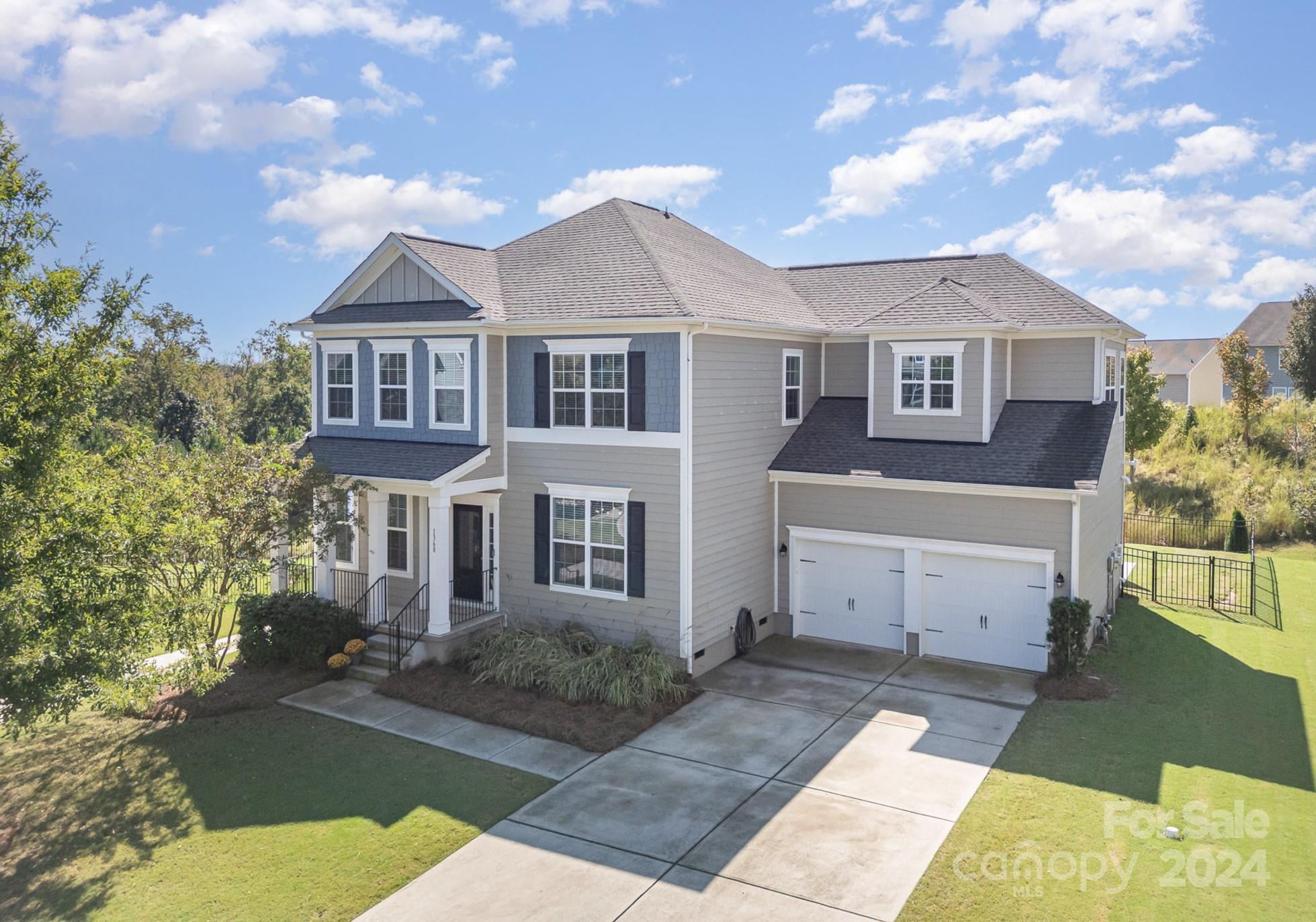 Welcome to this Waterside at the Catawba gem! Step onto the inviting covered front porch and into a home filled with custom details. Enjoy abundant natural light throughout the open floor plan. The kitchen features a spacious island with seating and prep space, a gas cooktop, double oven, and stainless steel appliances. A versatile flex space downstairs features stunning custom barn doors. Upstairs, a bonus room with a kitchenette and bathroom offers the perfect guest suite. The primary ensuite boasts custom closet built-ins. Relax on the screened-in porch overlooking the fenced backyard and extended patio. Solar panels (paid in full by the seller) enhance energy efficiency. This home also enjoys a community walking path adjacent to the property and easy access to downtown Fort Mill, Riverwalk Trail in Rock Hill, and Indian Land dining and retail. All of this, plus top rated Fort Mill schools! Don’t miss this exceptional home in a prime location!