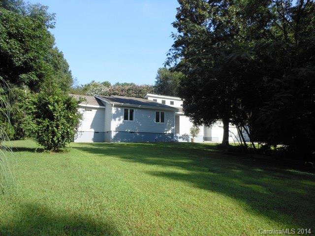 Lovely contemporary style home with lots of features. Handicap Accessible. 3 bedrooms, 1 1/2 baths. Beautiful hard wood flooring and wall to wall carpeting. Large eat-in kitchen, formal dining room, living room with fireplace, large sunroom and deck area. 2 car attached garage with upstairs bonus room and 1 car detached garage/workshop. This home also has an in-ground pool in a private setting. Established trees and foliage on 1.05 acre lot.