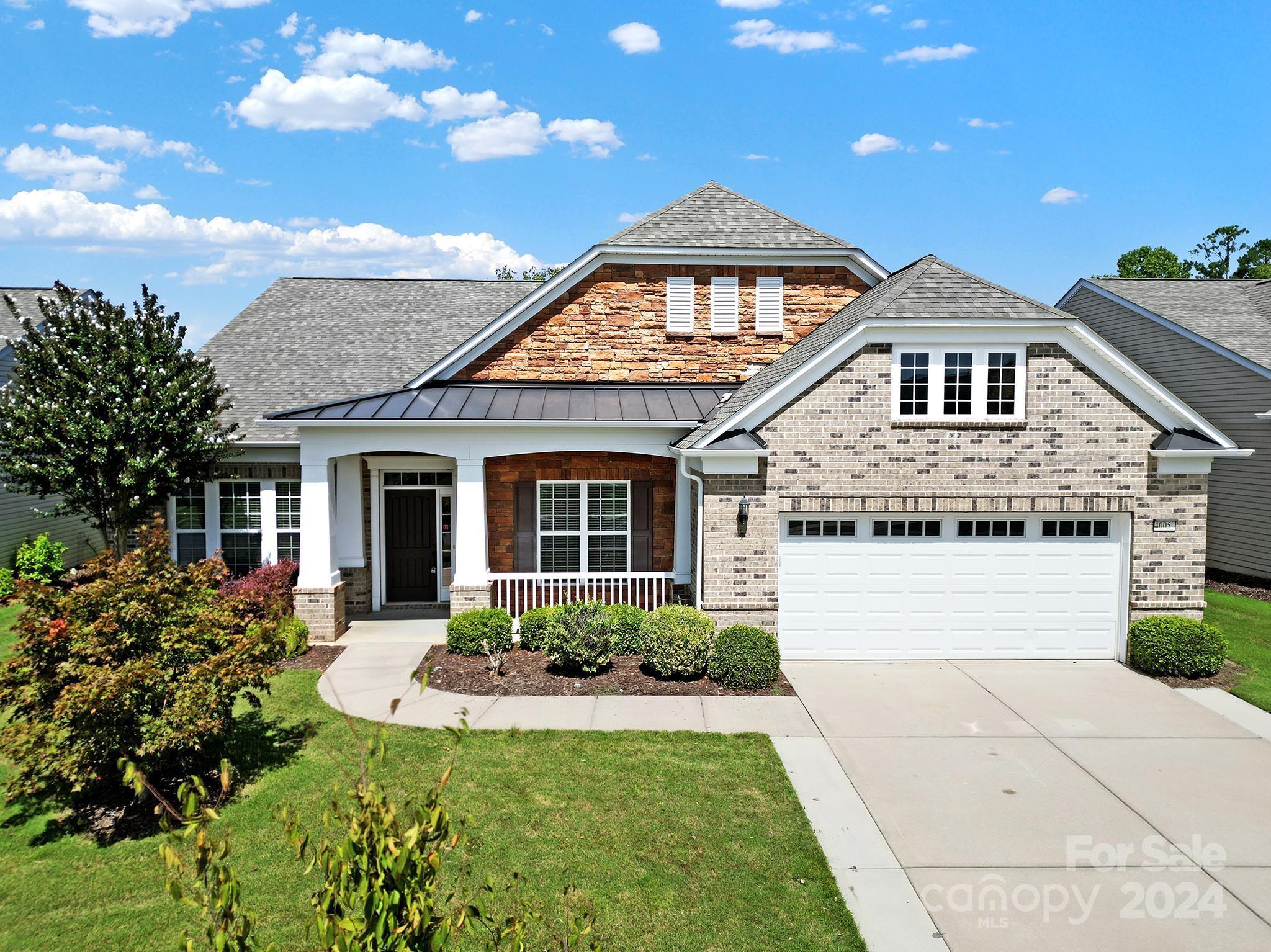 Move-in ready Morningside Lane w/ a sunroom & views of the lake! Enjoy cooking in the updated kitchen w/ LVP floors, granite counters, cream cabinets, SS appliances, gas cooktop & vent hood, solar tube, & a walk-in pantry. Eat meals at the island bar, in the dining nook off the great room, or in the formal dining room! Entertain guests in the great room, which has beautiful hardwood floors & built-ins, and flows into the spacious sunroom. The primary suite has a tray ceiling & a bathroom w/ an upgraded dual sink vanity, frameless glass shower, makeup vanity, & a large walk-in closet. 2 guest bdrms each have their own private bath! A front flex space has beautiful French doors w/ transom & sidelights, & can be used as a office, den, or hobby room! Relax in the screened porch or on the stamped concrete patio while enjoying the private view! 2-car garage w/ epoxy floors & walk-up attic storage, and an extended driveway. Don't miss this opportunity to join the active-adult lifestyle today!