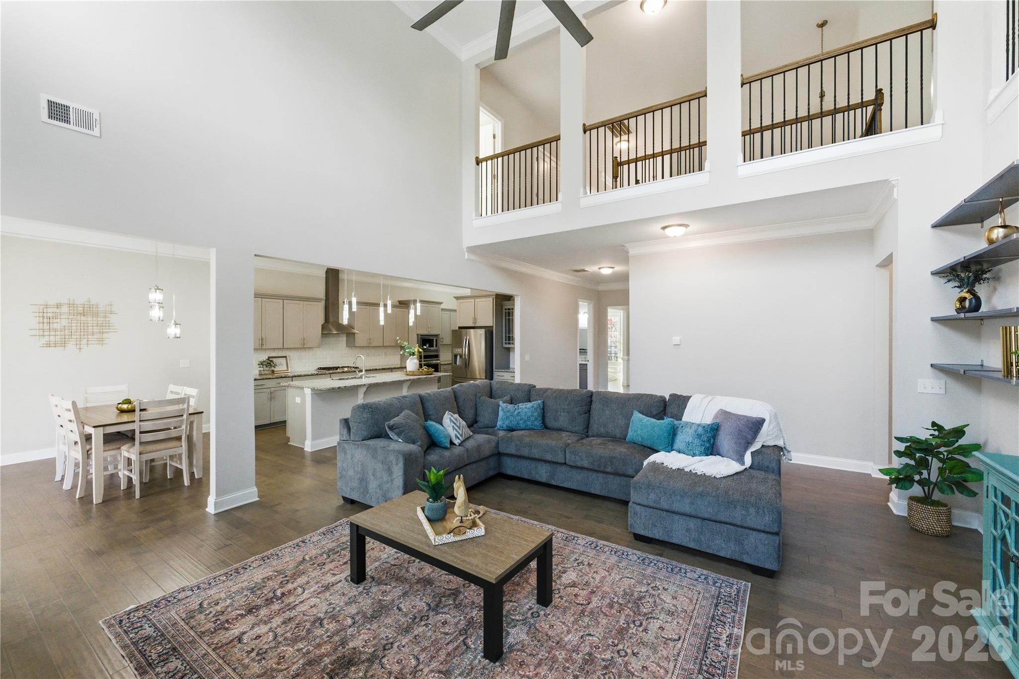 All the Tega Cay lifestyle. None of the dock maintenance.

For the buyer circling waterfront listings and hesitating over seawalls, lifts, and upkeep — this is the smarter math. 4,532 sqft of 2018 construction in The Manors at Lake Ridge, one of Tega Cay's most quietly coveted enclaves. 5 bedrooms, 5 full baths, 10-foot ceilings, and a thoughtful open plan built for how families actually live.
The chef's kitchen anchors the home: quartz counters, oversized island, gas cooktop, double wall ovens, walk-in pantry, and gray cabinetry flowing seamlessly into a family room warmed by a gas fireplace. Step through to the screened deck — year-round outdoor living, no dock required.
The 5/5 layout makes guest suites, multi-gen setups, or a dedicated home office effortless. Spa-style primary bath, generous secondaries, mixed-material exterior, and a two-car garage round out the package.
Here's the part most $1M Tega Cay buyers miss: HOA is ~$800/year. In return, residents enjoy an Olympic-sized pool with waterslide, tennis, basketball, playground, and scenic walking trails — for less than one quarterly dock bill. Top-rated Tega Cay schools. 20 minutes to Charlotte's major employers.

Seller offering up to $20,000 toward rate buy-down at closing — lock in the 5s.

Same Tega Cay lifestyle. Lower maintenance. Better numbers.