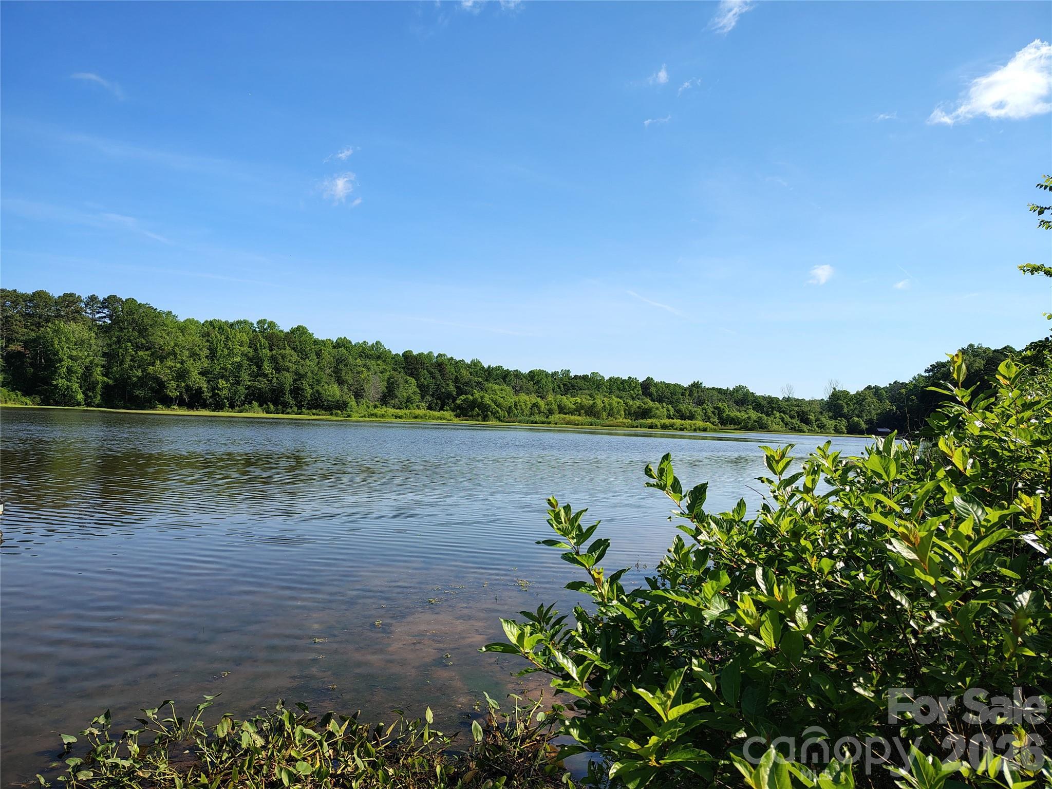 Almost a half-acre of waterfront land on Mountain Island Lake! Property contains a small, burned down house and other structures that will need to be cleared before building. Adjacent wooded lot (6385 Glenn Teague Road) also for sale, which totals almost a full acre of peaceful waterfront living.