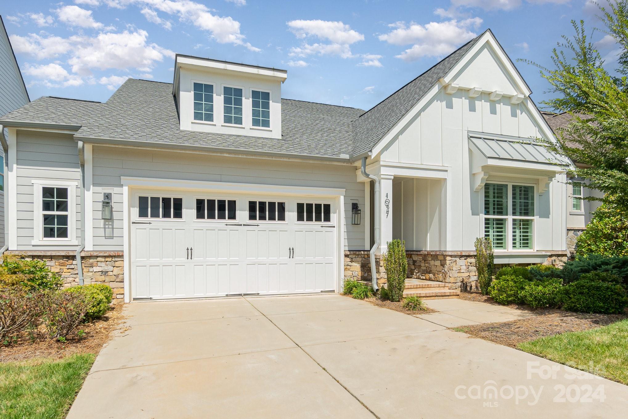 Discover luxury living in this immaculate 6-bedroom, 5.5-bath home, built in 2019 and thoughtfully designed for modern comfort. The first-floor primary suite offers convenience and privacy, featuring a spacious layout, spa-like bath, and walk-in closet. The heart of the home is a stunning open-concept kitchen with high-end appliances, a large island, and custom cabinetry, perfect for entertaining. Bright and airy living spaces are enhanced by large windows, flooding the home with natural light. Step outside to the adjustable screened-in back patio, an ideal space for year-round relaxation and outdoor dining. Located in a desirable neighborhood near  schools, shopping, and dining, this home is the perfect blend of luxury and convenience.