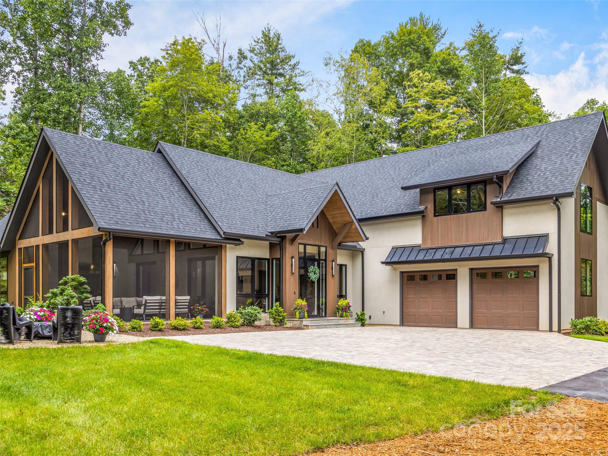 A rare opportunity for almost new construction in the prestigious Champion Hills Country Club on the renowned Tom Fazio golf course! Completed in 2024, this stunning 3,915 sq ft home is the builder's personal residence and showcases the exceptional quality, craftsmanship, and upgrades you'd expect. The dramatic great room features soaring beamed ceilings and two walls of glass, flooding the space with natural light and connecting seamlessly to the outdoors. Pocketing sliders lead to a screened outdoor living area complete with outdoor kitchen, fire pit and putting green. The gourmet kitchen is a chef's dream with Thermador appliances, a coffee bar, and a huge walk-in pantry. The main level includes a luxurious owner's suite, guest bedroom, and large office. Upstairs you'll find two private guest suites and a spacious home gym or game room. Designer furnishing package with original paintings available for $75,000. A true luxury retreat--seller is the builder and listing agent.