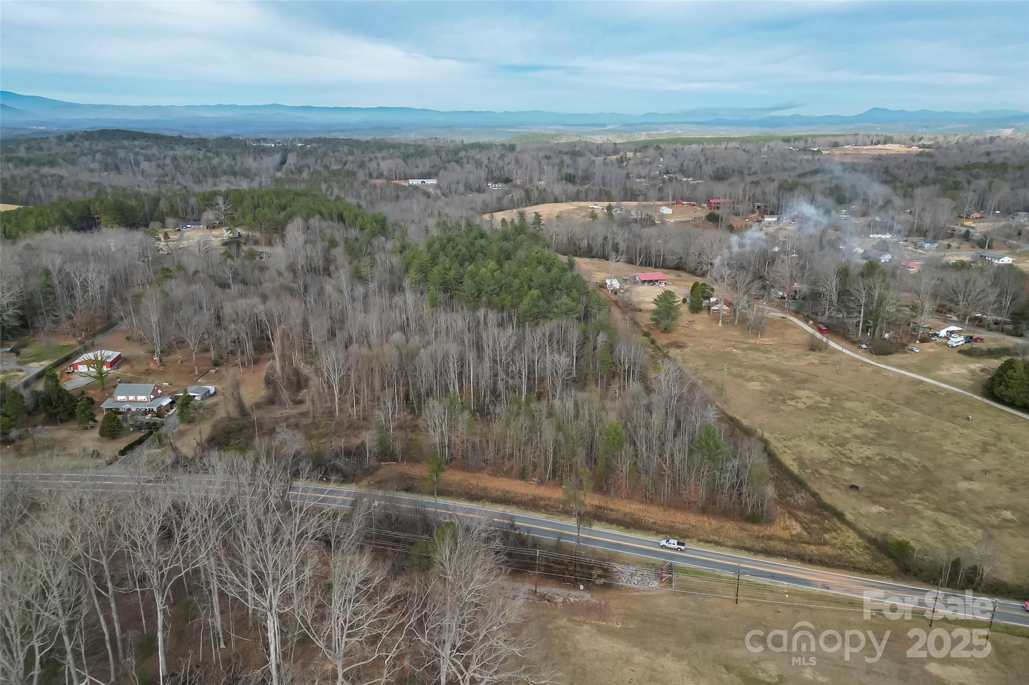 Many possibilities for development in this 11 acre level tract of land located  just outside Morganton City Limits. Zoned R-1   Valdese water available, water tap needed. Septic needed.