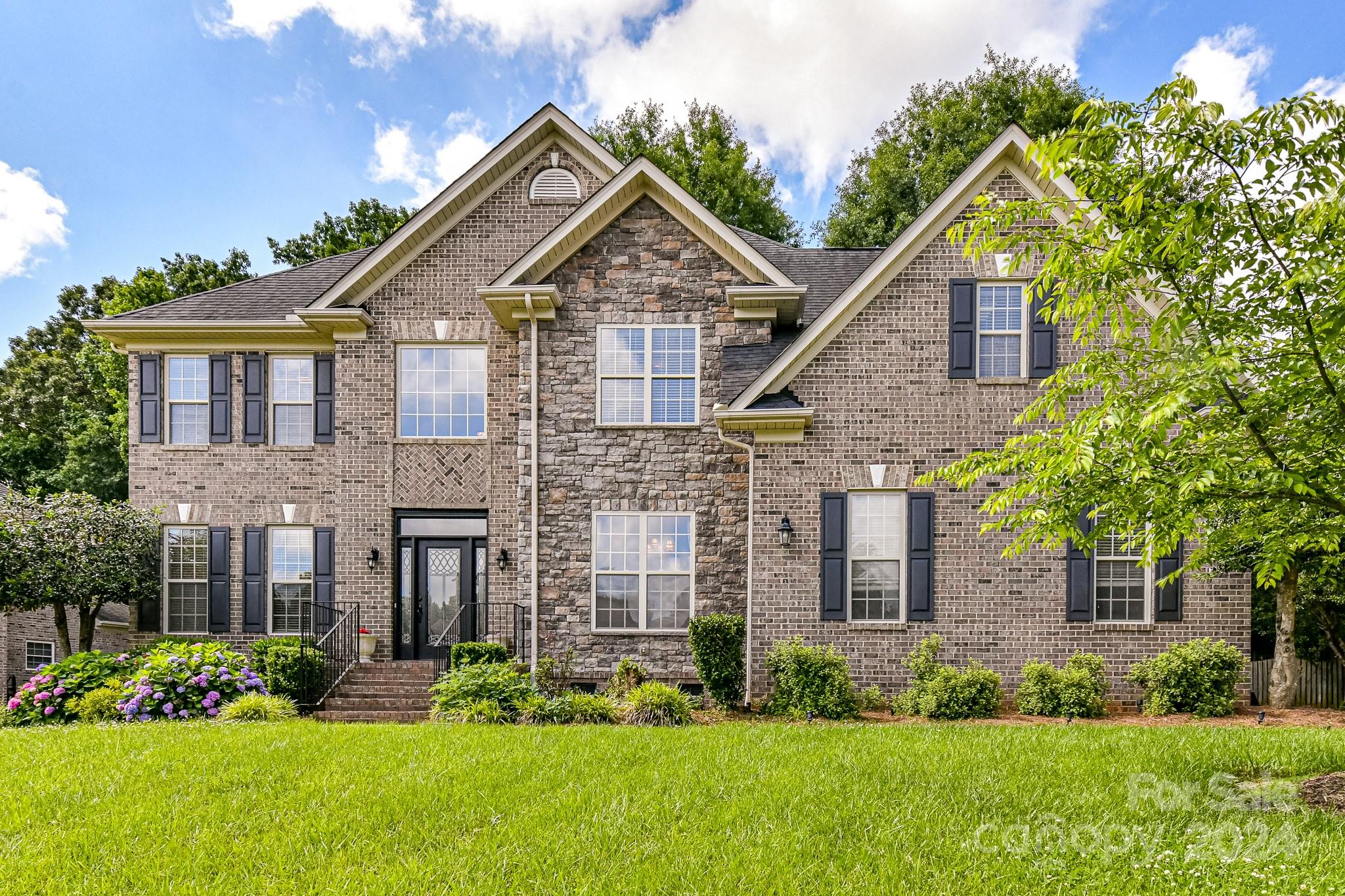 Discover elegance and comfort in this exquisite full brick custom built home with charming stone accents in the Shannamara neighborhood. Step inside to explore a world of possibilities: There is a 5th Bedroom/Flex Room & Full Bathroom on Main. Versatility meets convenience! Embrace productivity in the dedicated office space. Indulge in sophisticated dining experiences in the formal dining room. Entertain with ease! Serve guests seamlessly with the butler's pantry, while the walk-in pantry provides ample storage for all your culinary delights. Kitchen w/Granite Counters, Tile Backsplash, Gas Stainless Steel Range and Appliances. Retreat to your private sanctuary! Unwind in the luxurious primary bedroom featuring a cozy sitting area. Primary Bathroom with 2 Walk-In Closets, Linen Closet and Dual Vanities. One Secondary Bedroom upstairs w/En Suite Bathroom. Spacious Bonus Room. Large deck overlooking the beautifully landscaped fenced yard with landscape lighting and irrigation system.