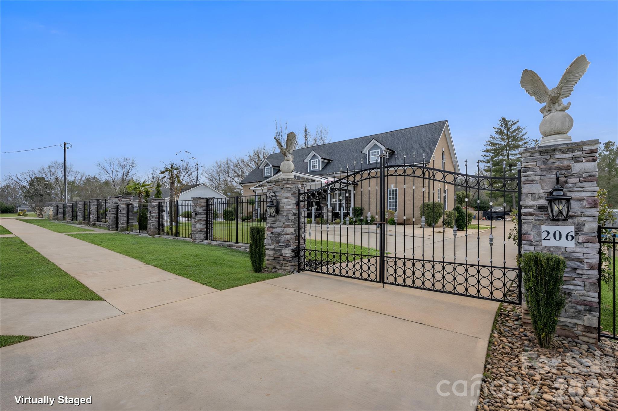 Hidden luxury awaits. Built in 2020, this stunning two-story custom home features 10-foot ceilings on main level, ceramic tile flooring, tray ceilings, and recessed lighting throughout. A striking, internationally custom-ordered front door welcomes you into a receiving den with a cozy marble fireplace, flowing seamlessly into the open and spacious living room, perfect for entertaining.
The gourmet kitchen boasts stainless steel appliances and a show-stopping island with a waterfall marble countertop. The primary suite is a true retreat, featuring tray ceilings and a spa-inspired bathroom with ceramic tile walls, double vanity, stand-up shower, and garden tub. Upstairs, you’ll find 9-foot ceilings, a spacious family room ideal for a home theater, gym, or entertainment area, along with an additional bedroom, bonus room perfect for an office or guest room, and a full bathroom.
Step outside through elegant French doors to a large covered rear porch and paved patio with a brick fireplace, overlooking beautifully landscaped grounds accented with palm trees. Follow the paved walkway to a firepit area with built-in swing chairs, creating a serene outdoor oasis. The property also includes a 12x30 she-shed with a covered front porch, ideal for an office, gym, or creative space, as well as an impressive 30x60 workshop with 12-foot ceilings, two half baths, and a second-level floor, currently used as a workshop and party area.
Conveniently located near Hwy 29 and I-85, and just 10 minutes from shopping, groceries, and entertainment, this one-of-a-kind property offers luxury living with unmatched versatility.